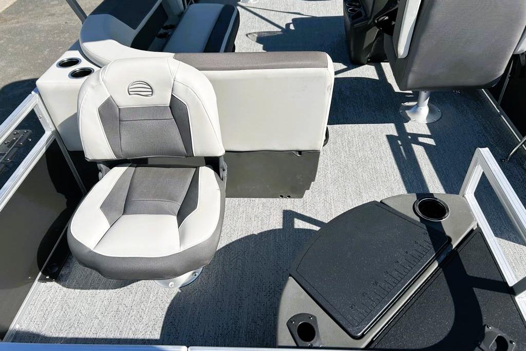 2026 Sun Tracker Bass Buggy 18 DLX interior with seating and cup holders.