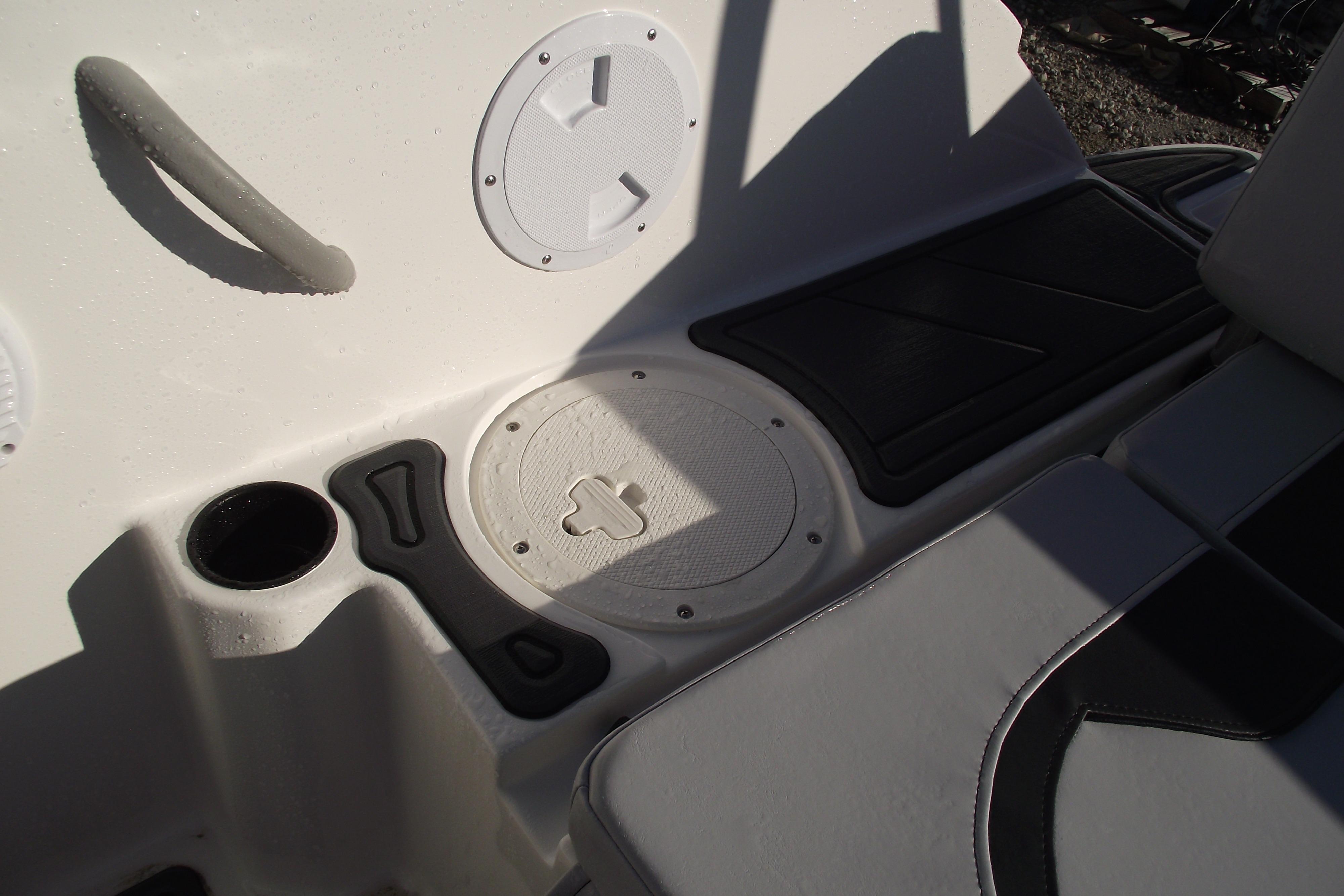 Interior of 2026 Bayliner M19 boat showing seating and storage compartments.