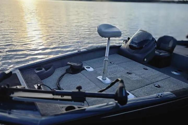 2020 Tracker Pro Team 175 TF boat on calm water at sunset.