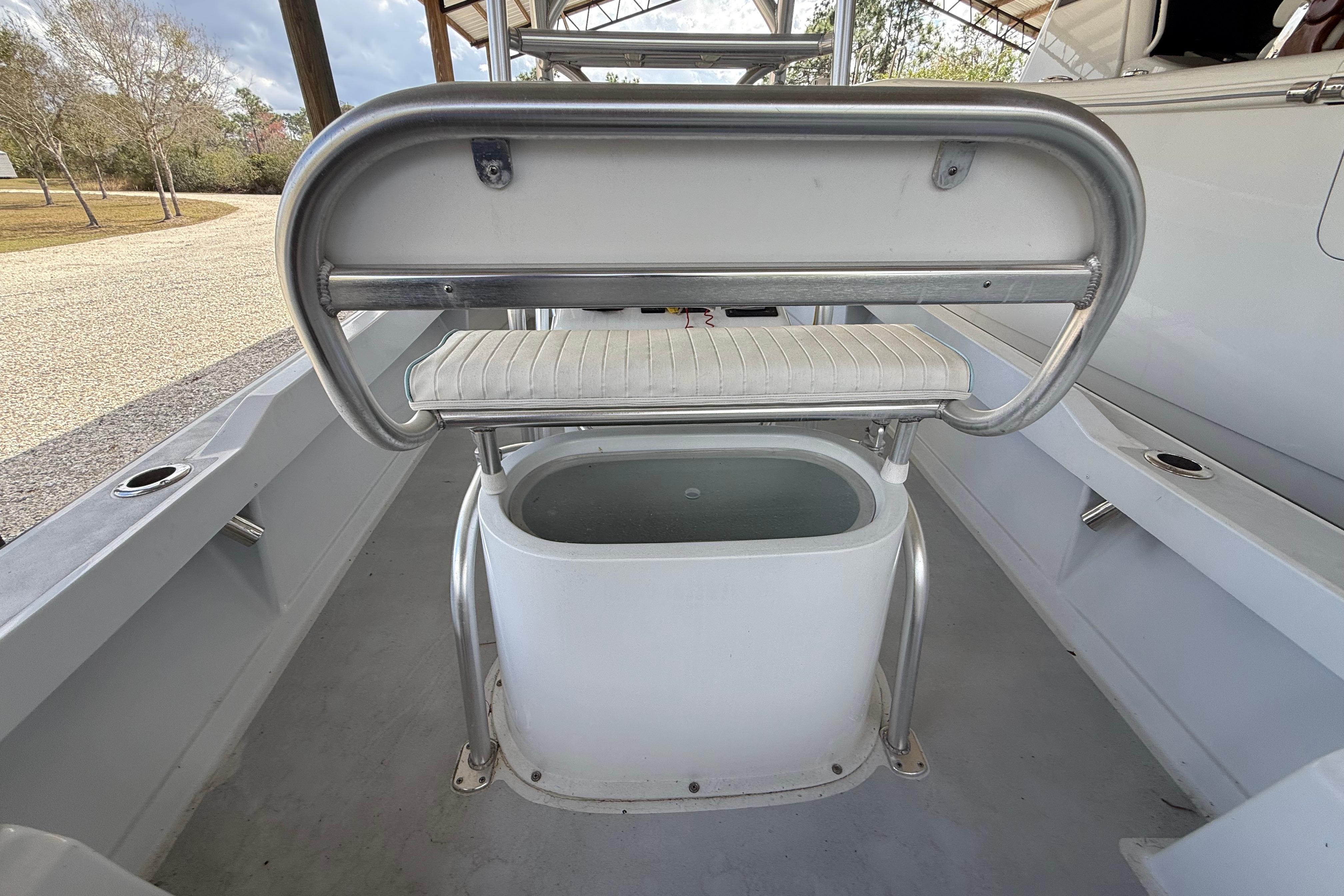 1974 Aquasport 2400 Center Console interior with seating and storage.