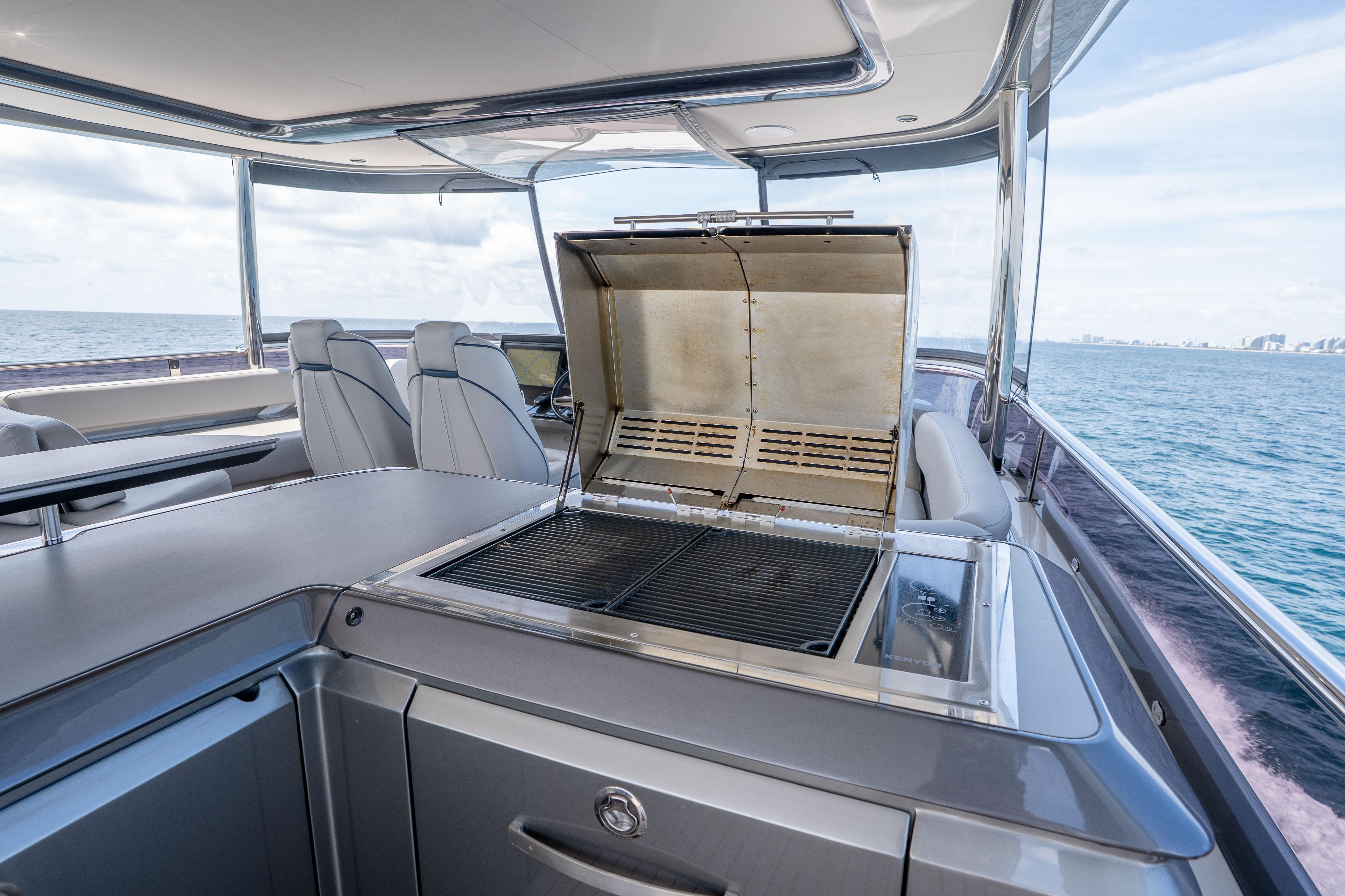 Luxury yacht Princess Y85 2020 with outdoor grill and ocean view.