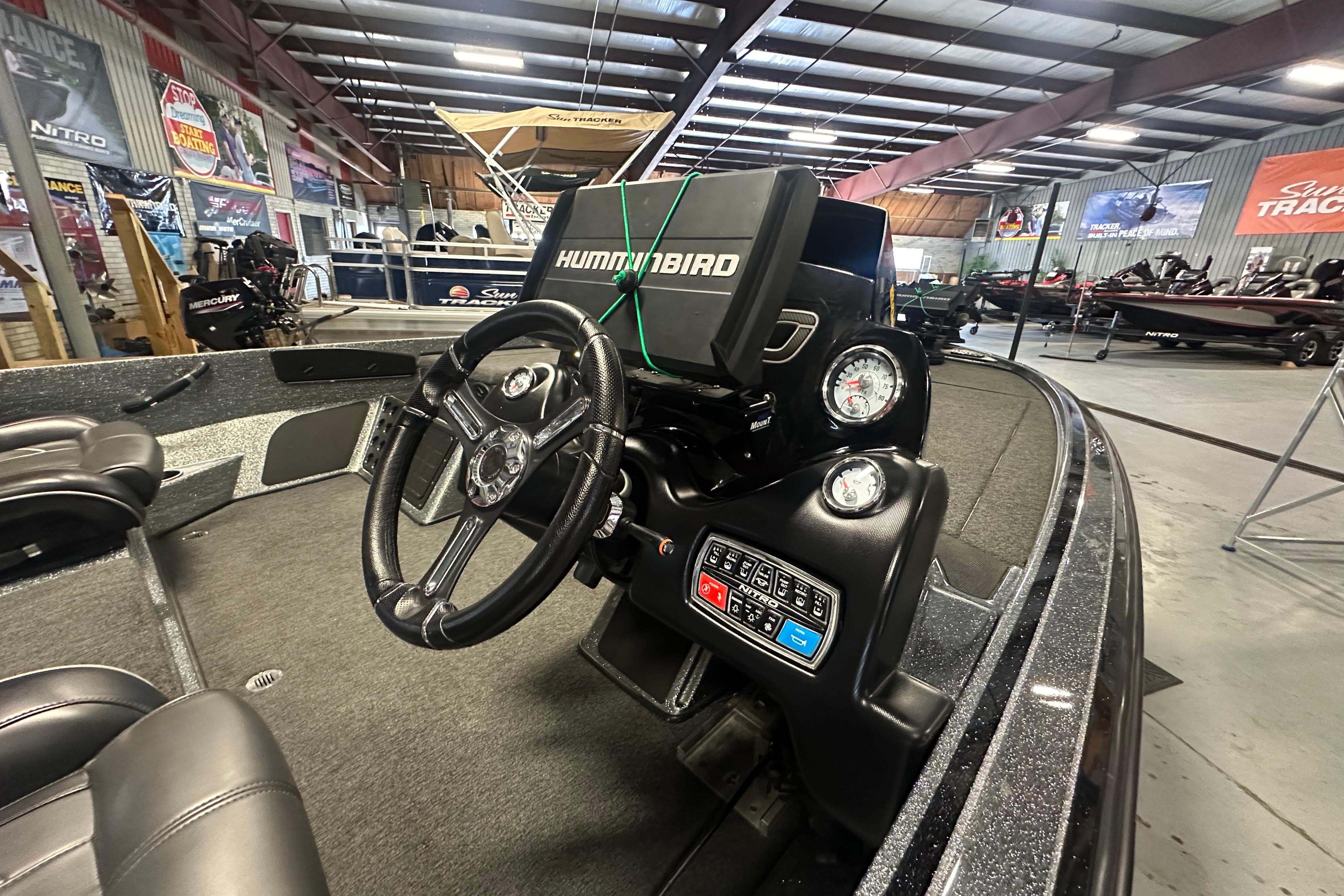 Interior of a 2018 Nitro Z20 Pro boat with steering wheel and Humminbird electronics.