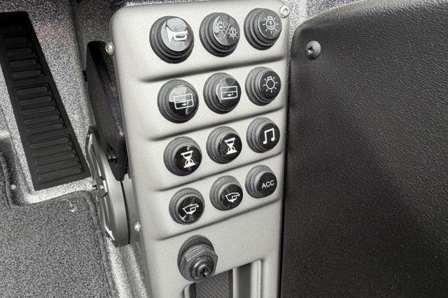Control panel of 2025 Ranger 1850MS boat with various function buttons.