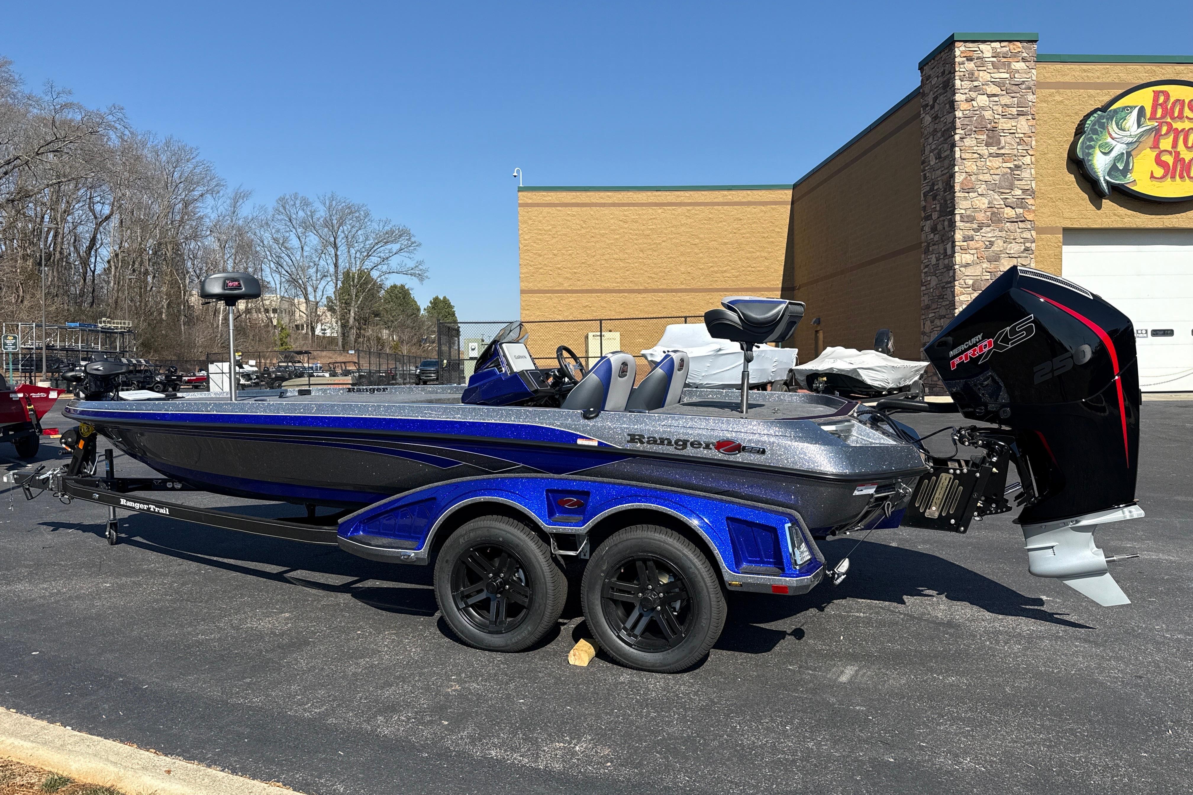 2026 Ranger Z521 boat with trailer, parked outside Bass Pro Shop.