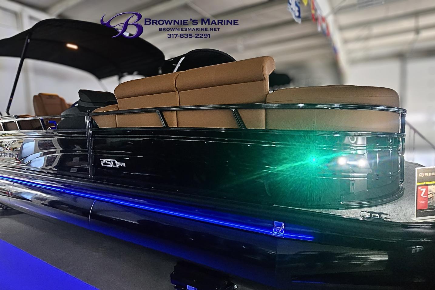 2026 Regency 250 DL pontoon boat with sleek black design and tan seating.