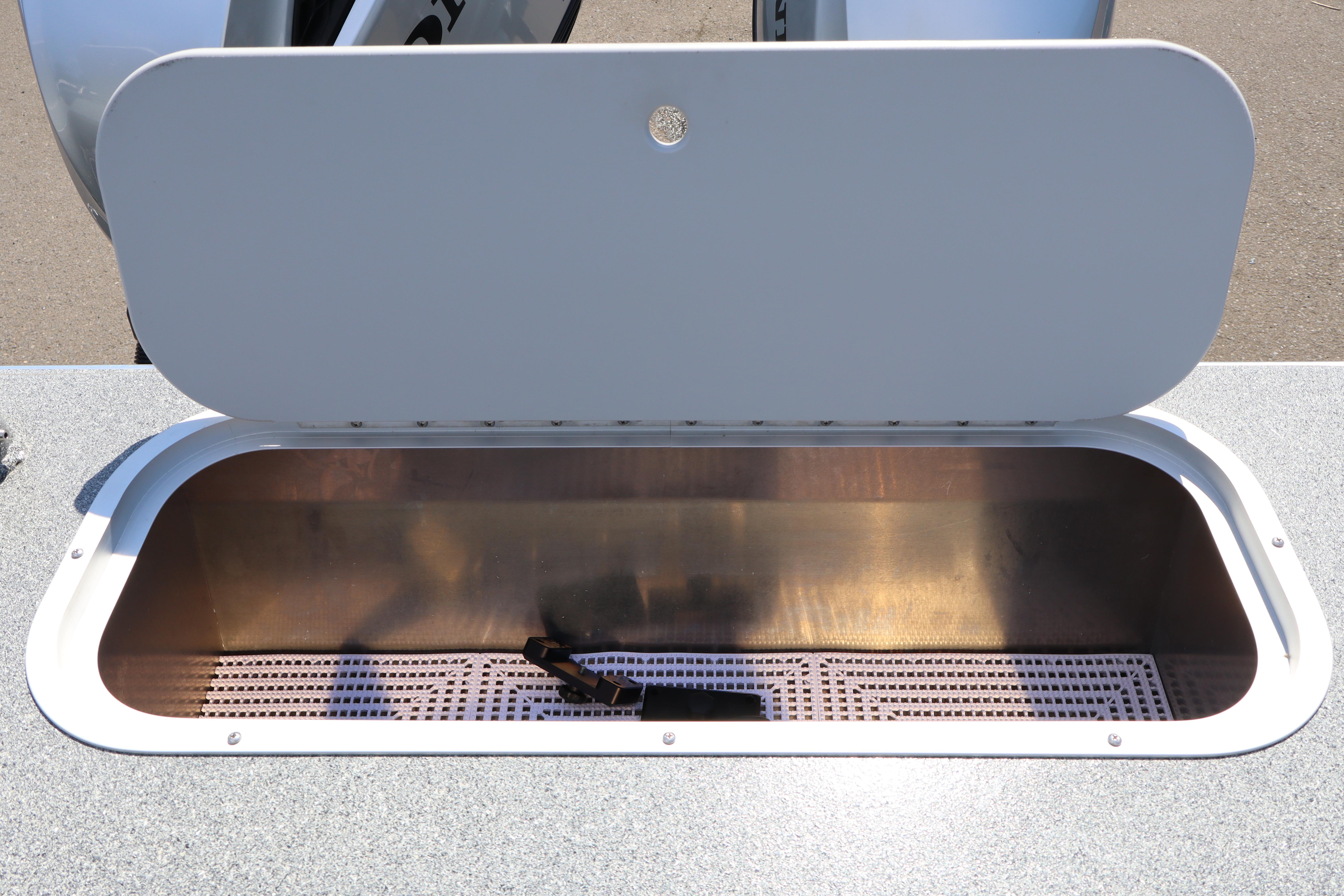 Open storage compartment on 2025 NorthRiver SEAHAWK boat, showcasing interior space.