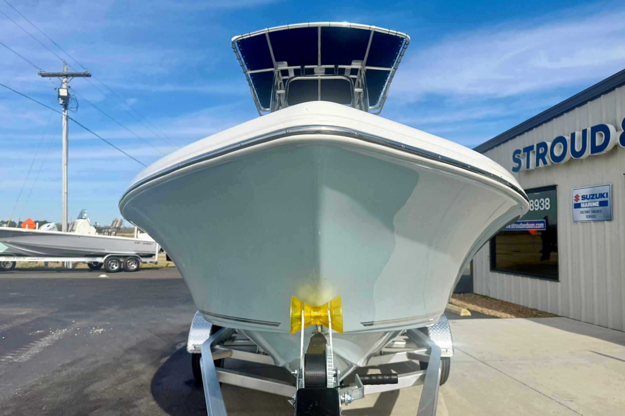 2026 Key West 189 FS boat on trailer outside dealership, clear blue sky.