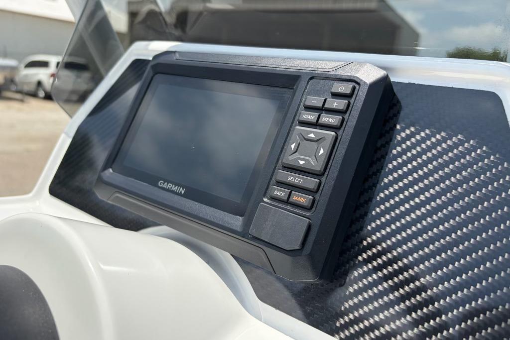 Garmin navigation system on 2026 Highfield Classic 360 boat dashboard with carbon fiber finish.