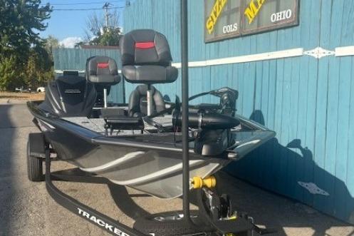 2026 Tracker Pro Team 195 boat parked outside a blue building in Ohio.
