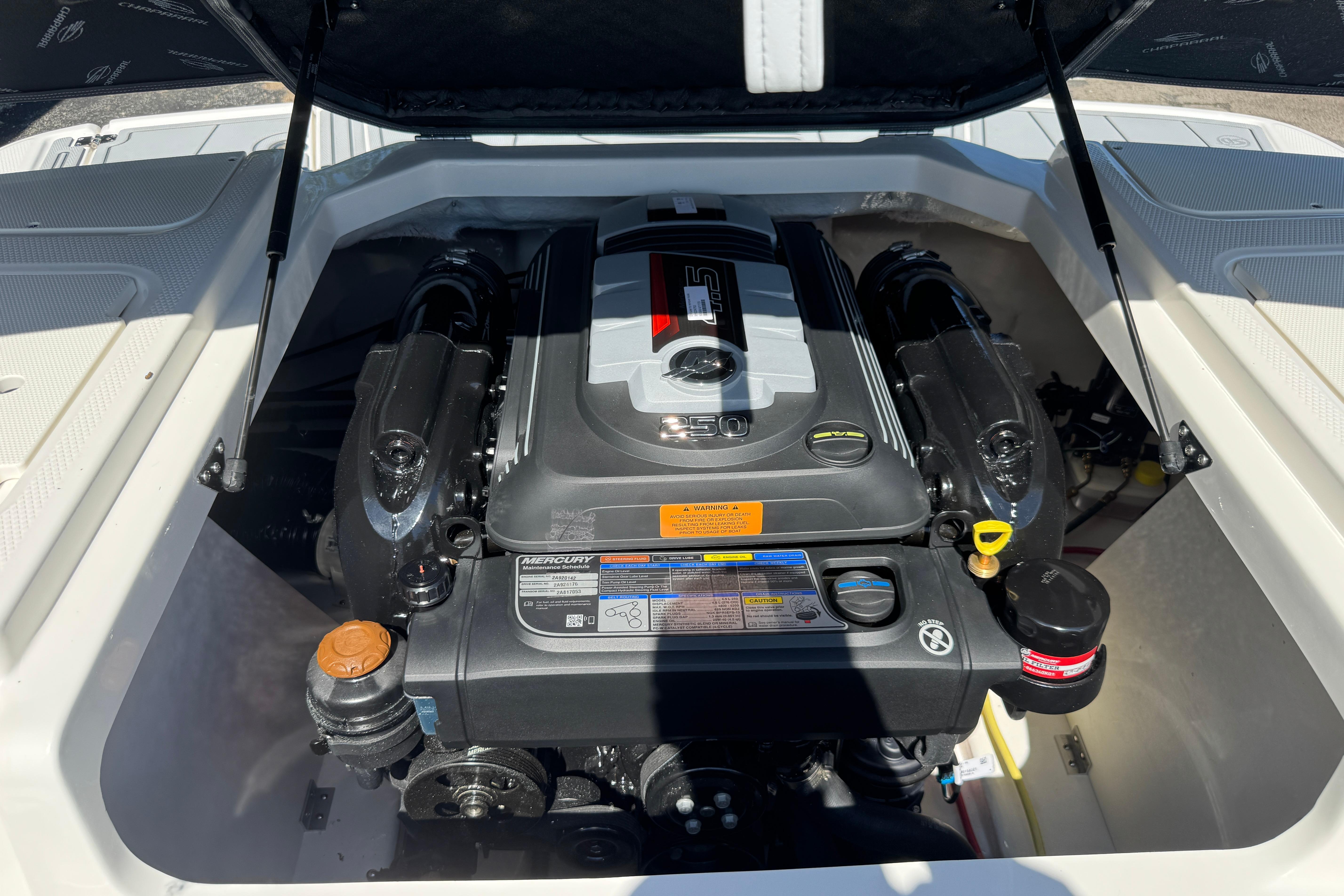 Engine compartment of 2026 Chaparral 21 SSi boat, showcasing powerful Mercury engine.