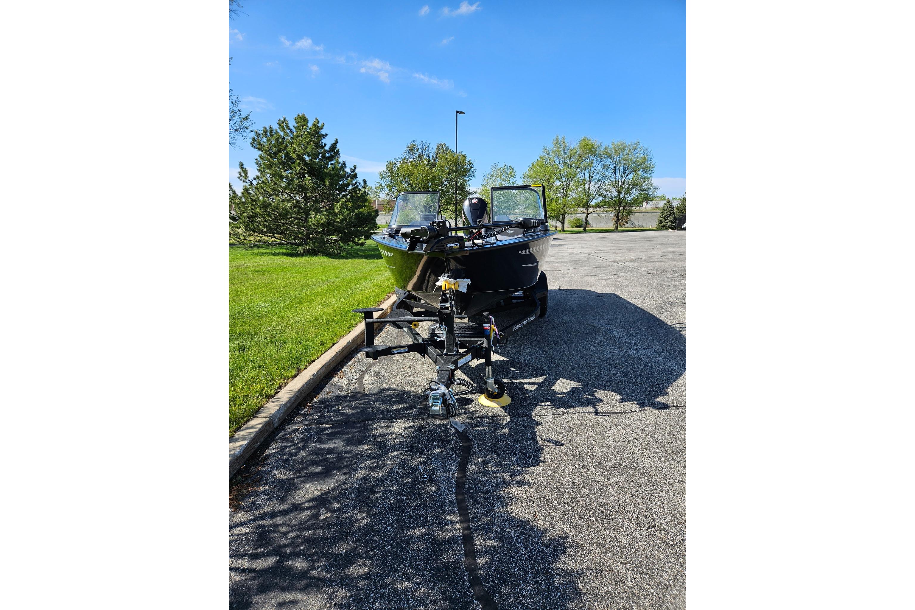 2026 Ranger VX1888 WT boat on trailer in sunny parking lot.