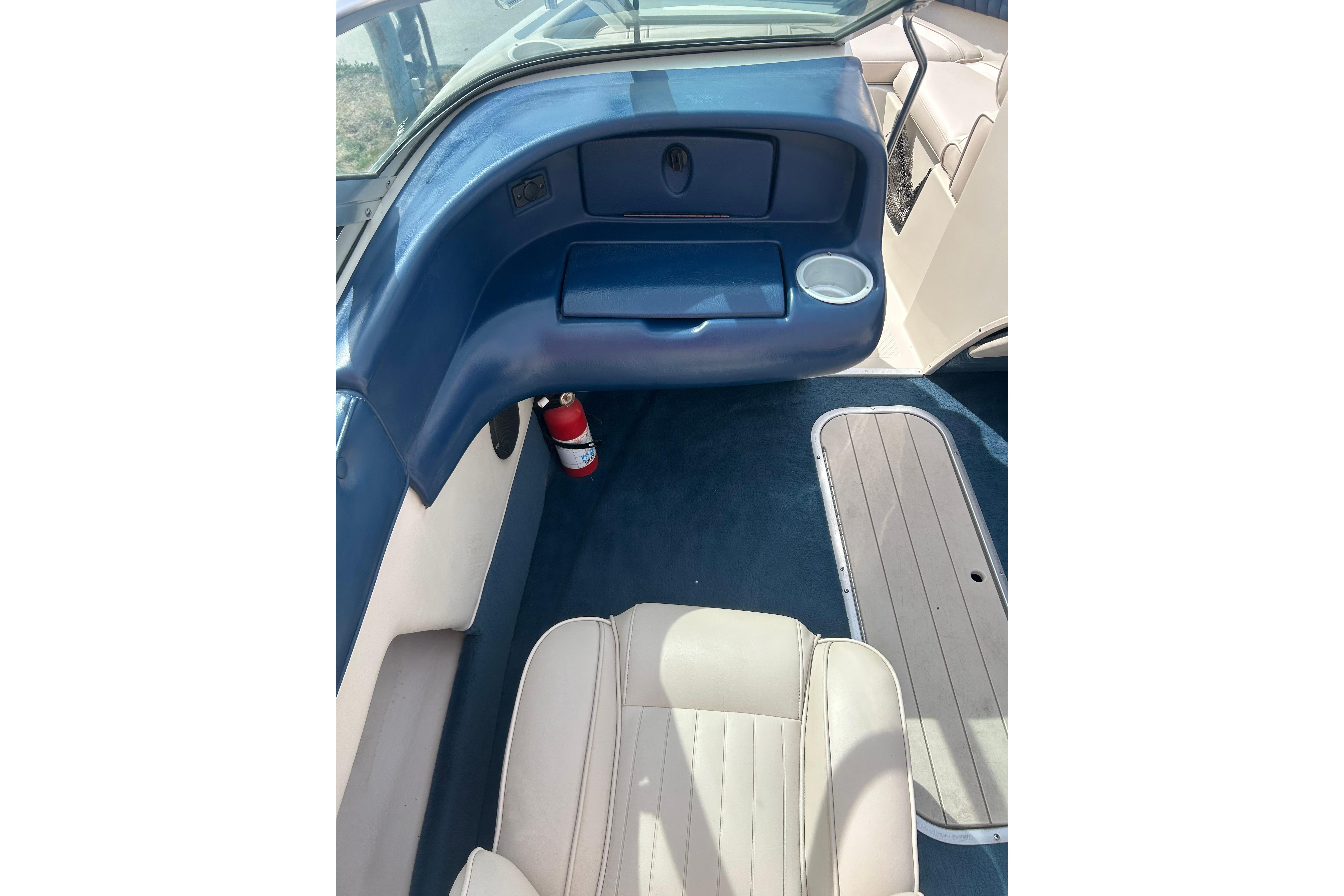 Interior of a 1996 Mariah 180 Shabah boat with blue and beige seating.