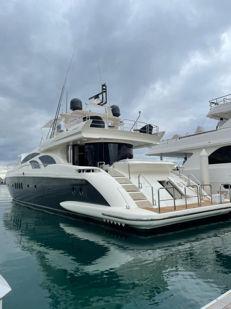 Luxury yacht Azimut 98 Leonardo 2003 docked under cloudy skies.
