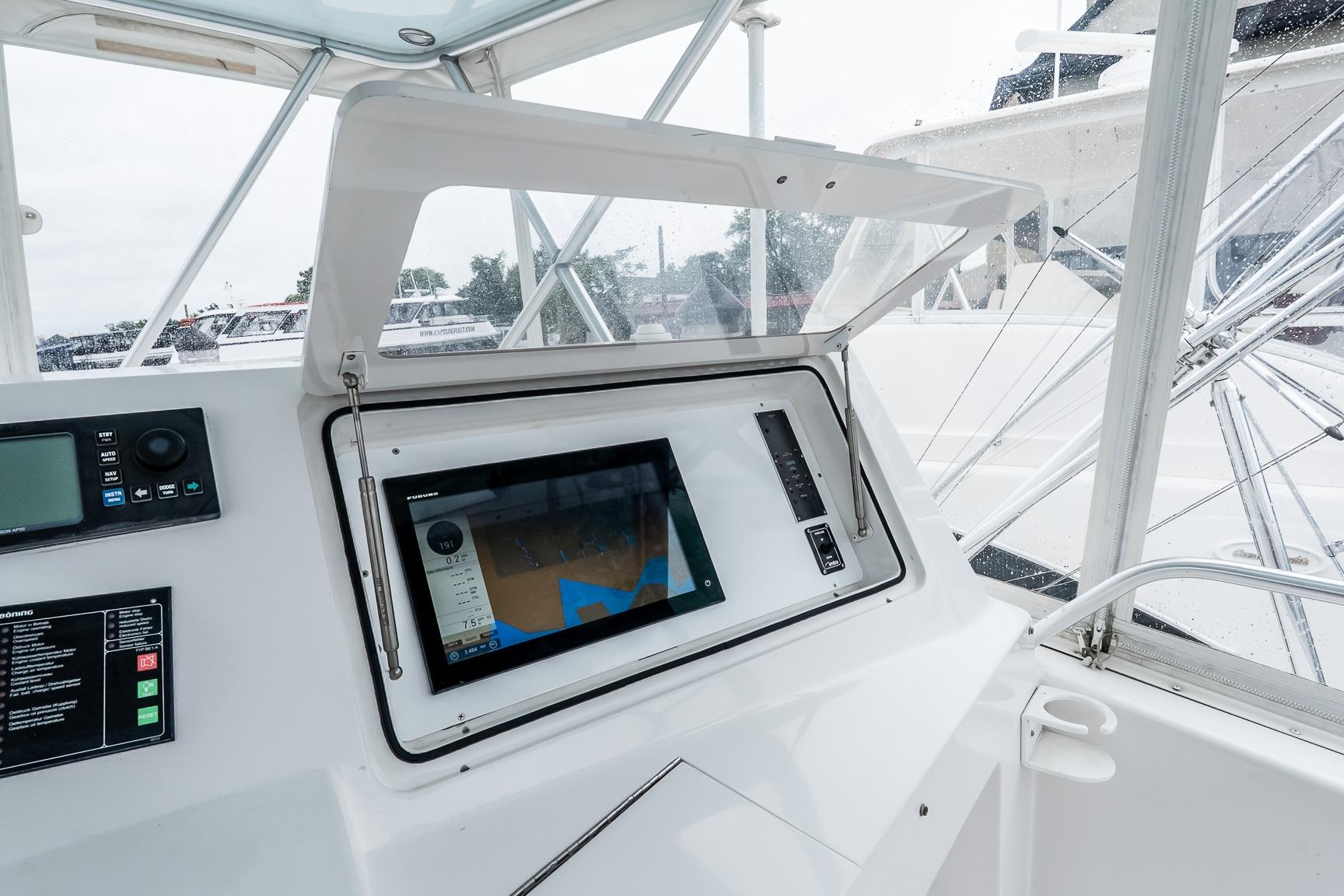 Control panel of a 2000 Viking 50' Convertible yacht with navigation display.
