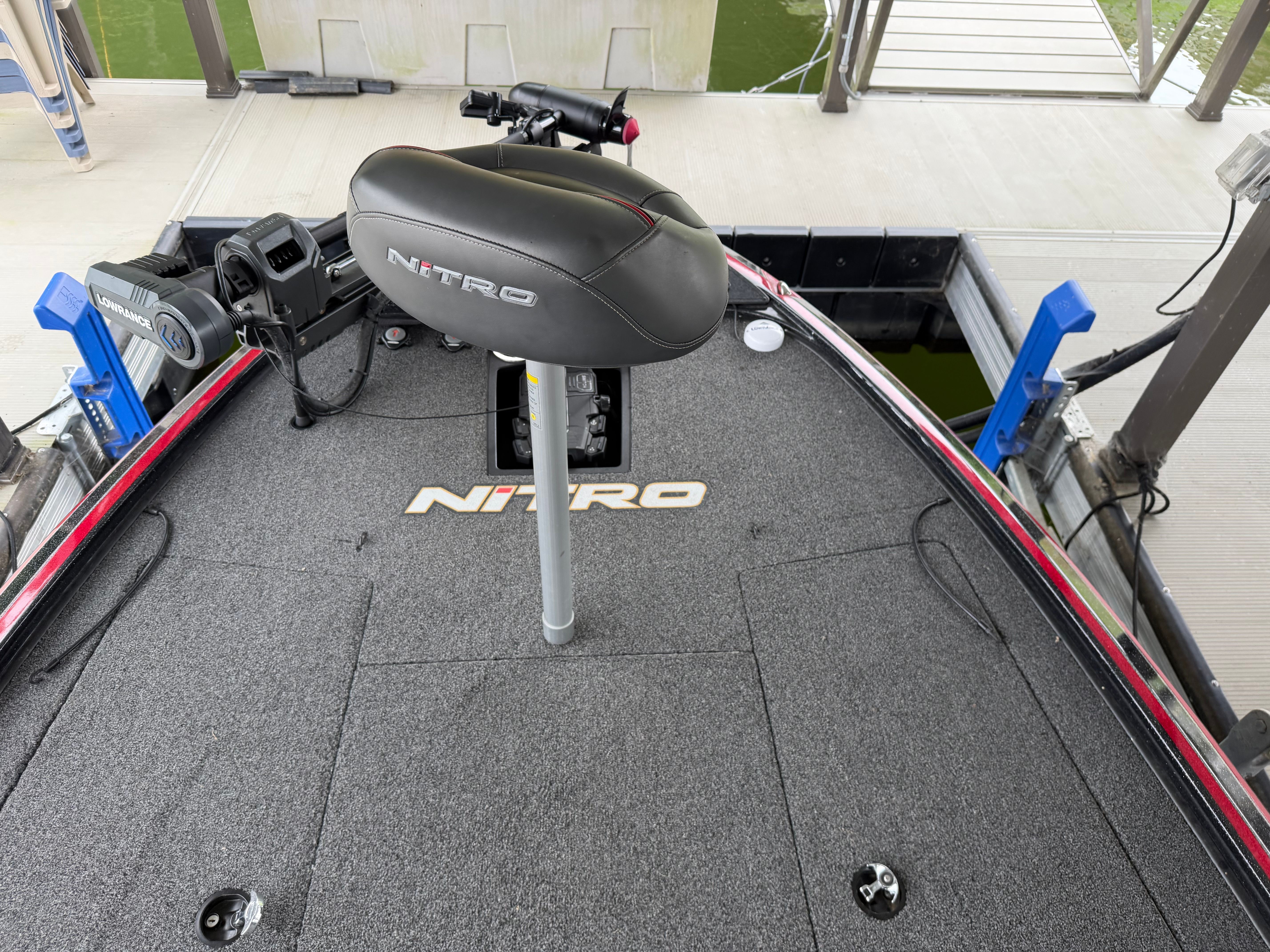 The image shows the deck of a 2024 Tracker Z19 boat with a seat and controls.