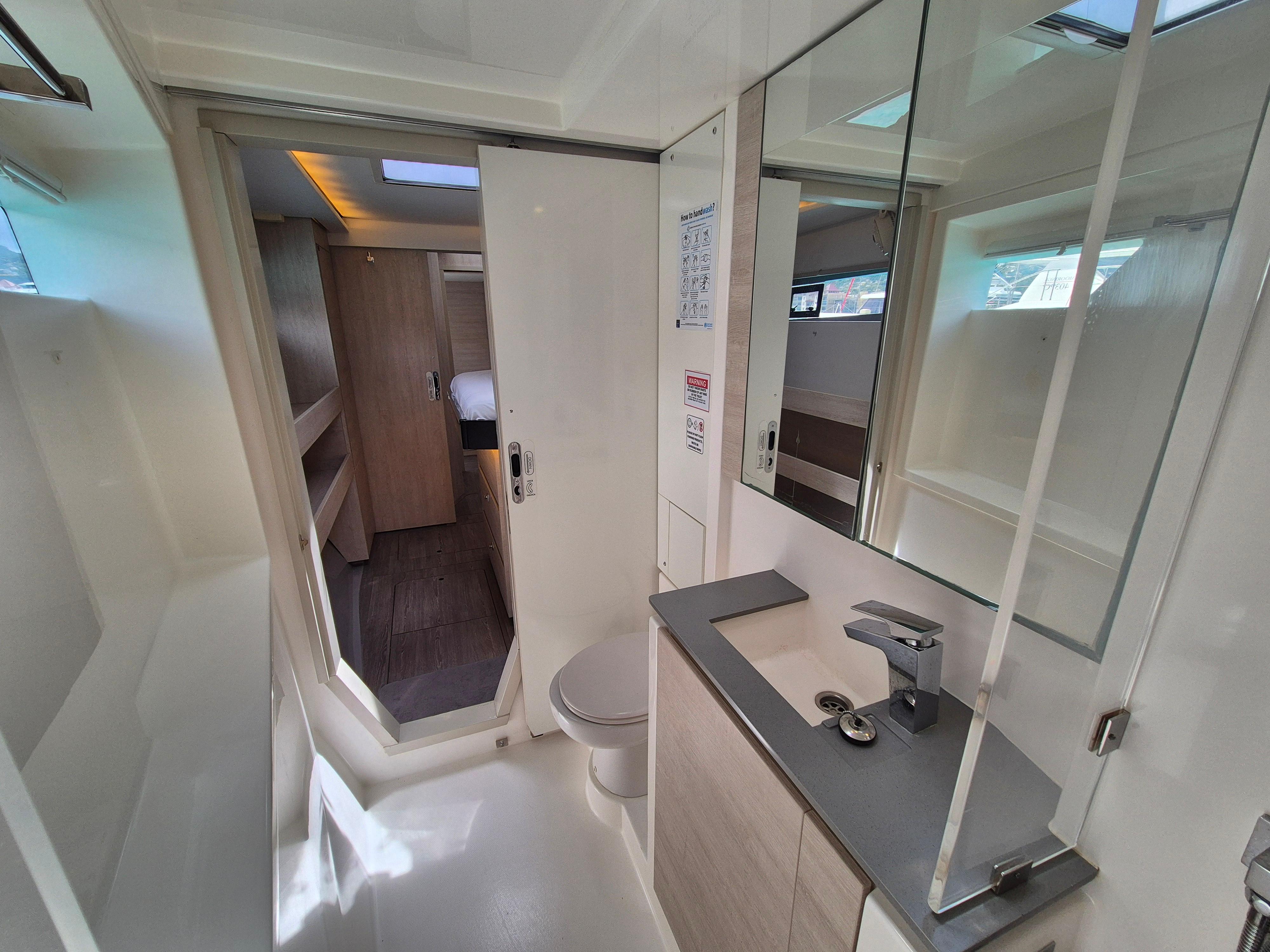Modern bathroom interior on a 2020 Leopard 50 yacht, featuring sleek design and amenities.