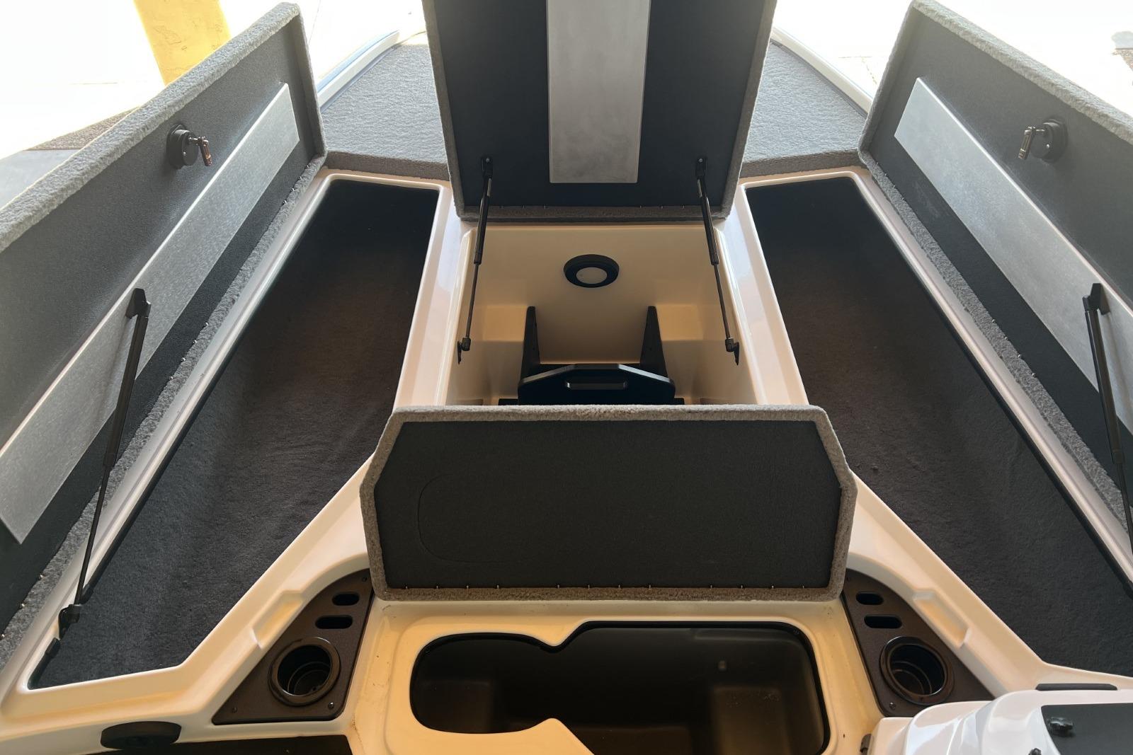2025 Nitro Z19 boat storage compartments with open lids, showcasing spacious interior design.