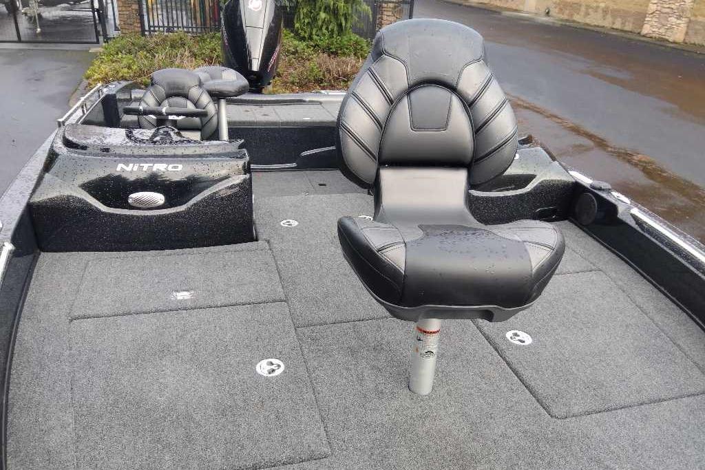 2025 Nitro ZV19 boat interior with sleek seating and carpeted deck.