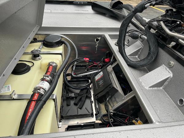 2024 Lowe Legacy boat engine compartment with wiring and fuel system components.