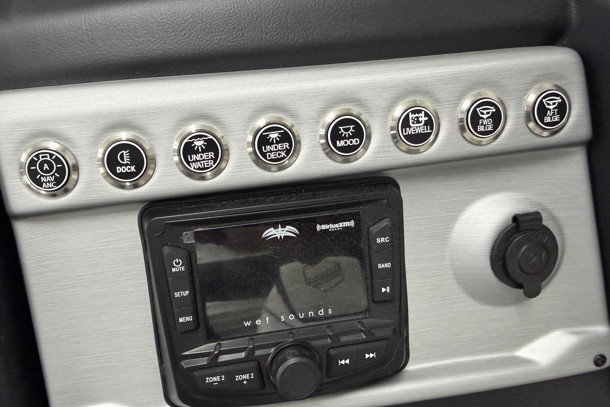 Control panel of 2026 South Bay 525SB2 boat with various function buttons and audio system.