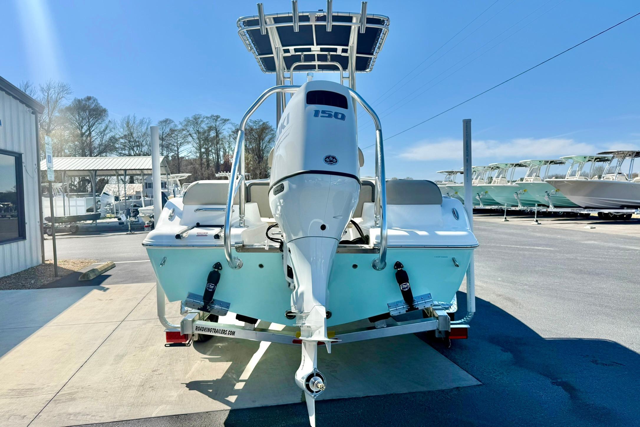 2026 Key West 189 FS boat with 150 HP engine on trailer, sunny day.