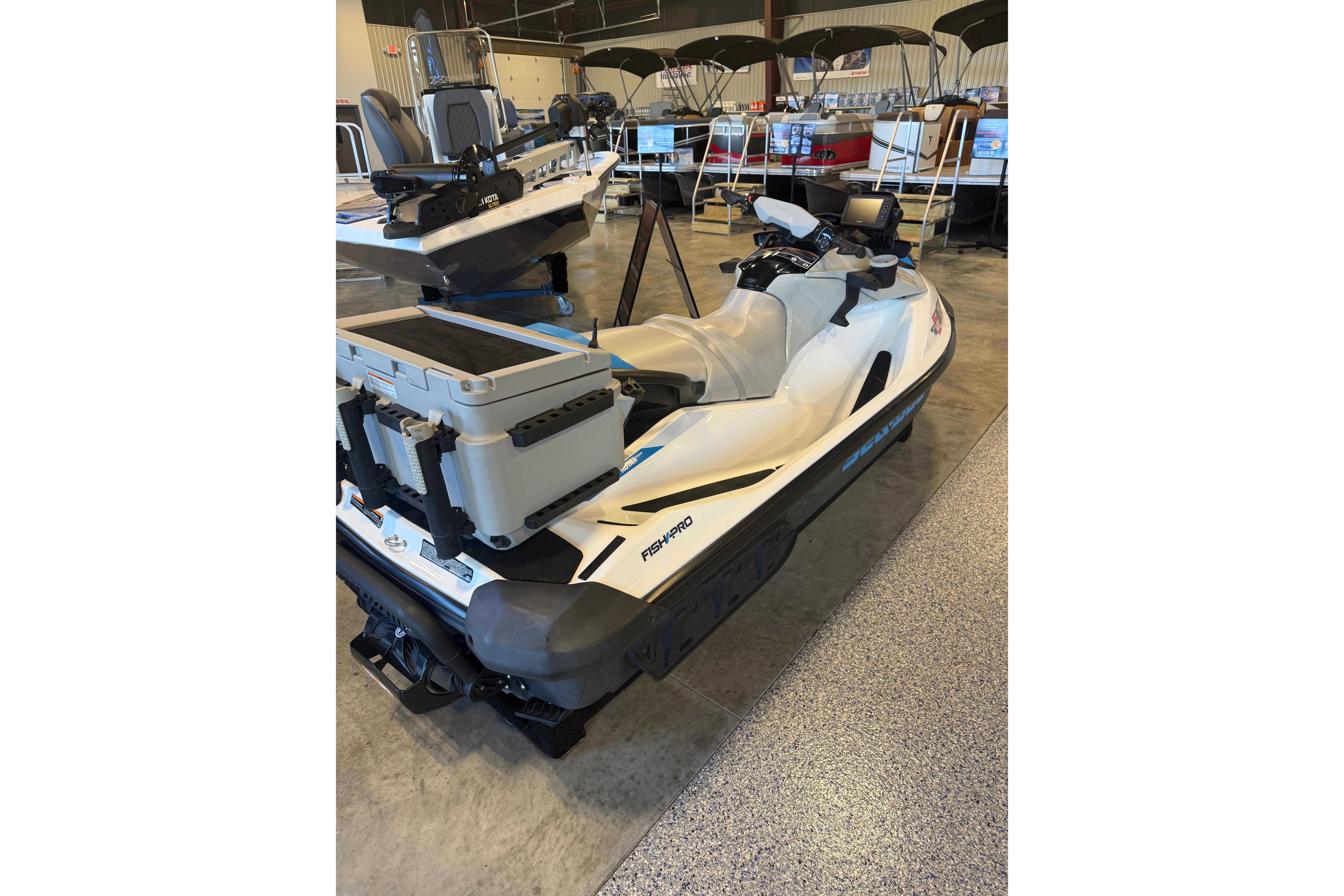 2022 Seadoo FishPro jet ski in showroom, equipped with storage and fishing gear.