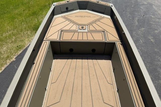 2026 Tracker Grizzly 1650 T Prairie Wings Edition boat interior with tan decking.