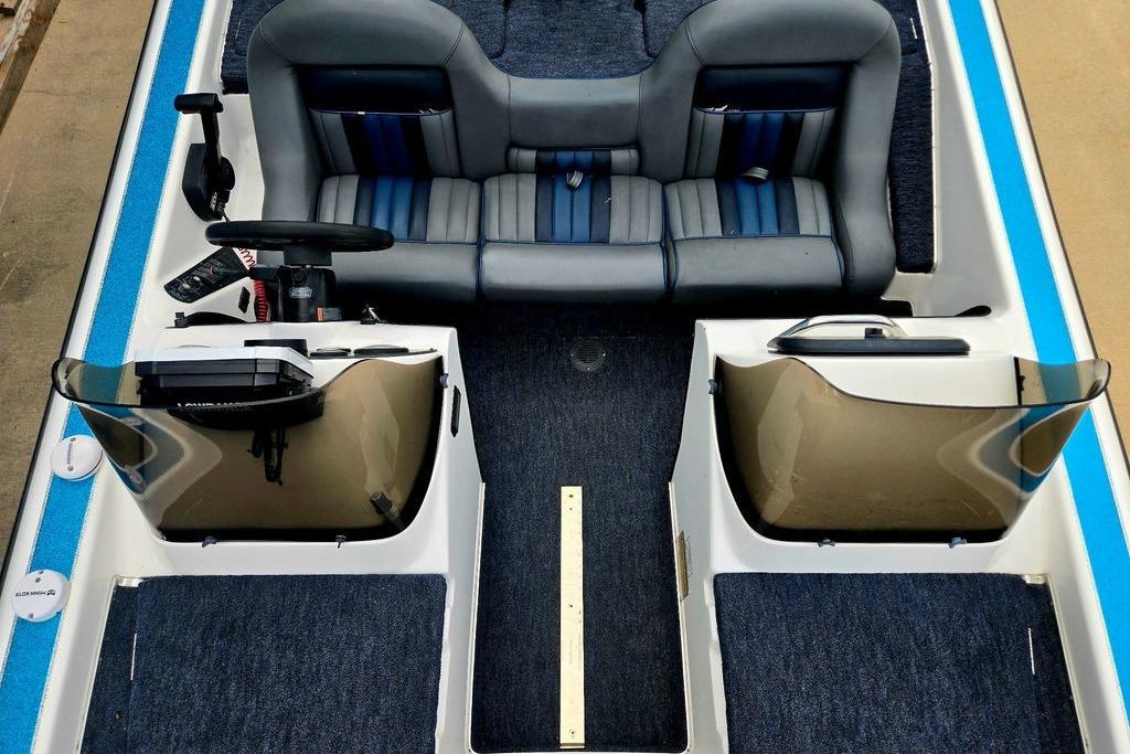 1996 Champion 181 SX boat interior with dual seats and steering console.
