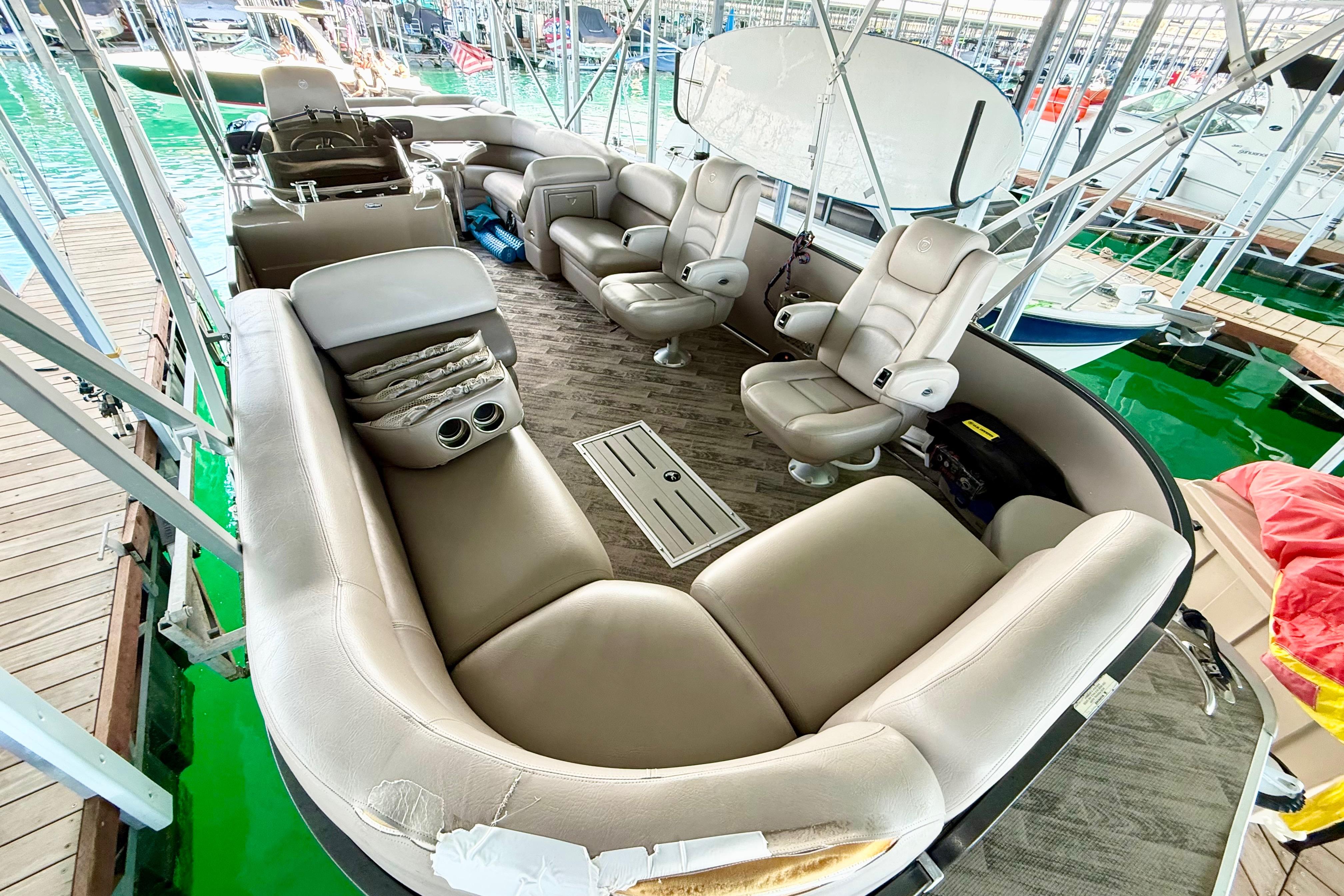 Luxurious 2011 Premier 275 Grand Majestic PTX pontoon boat interior with plush seating.