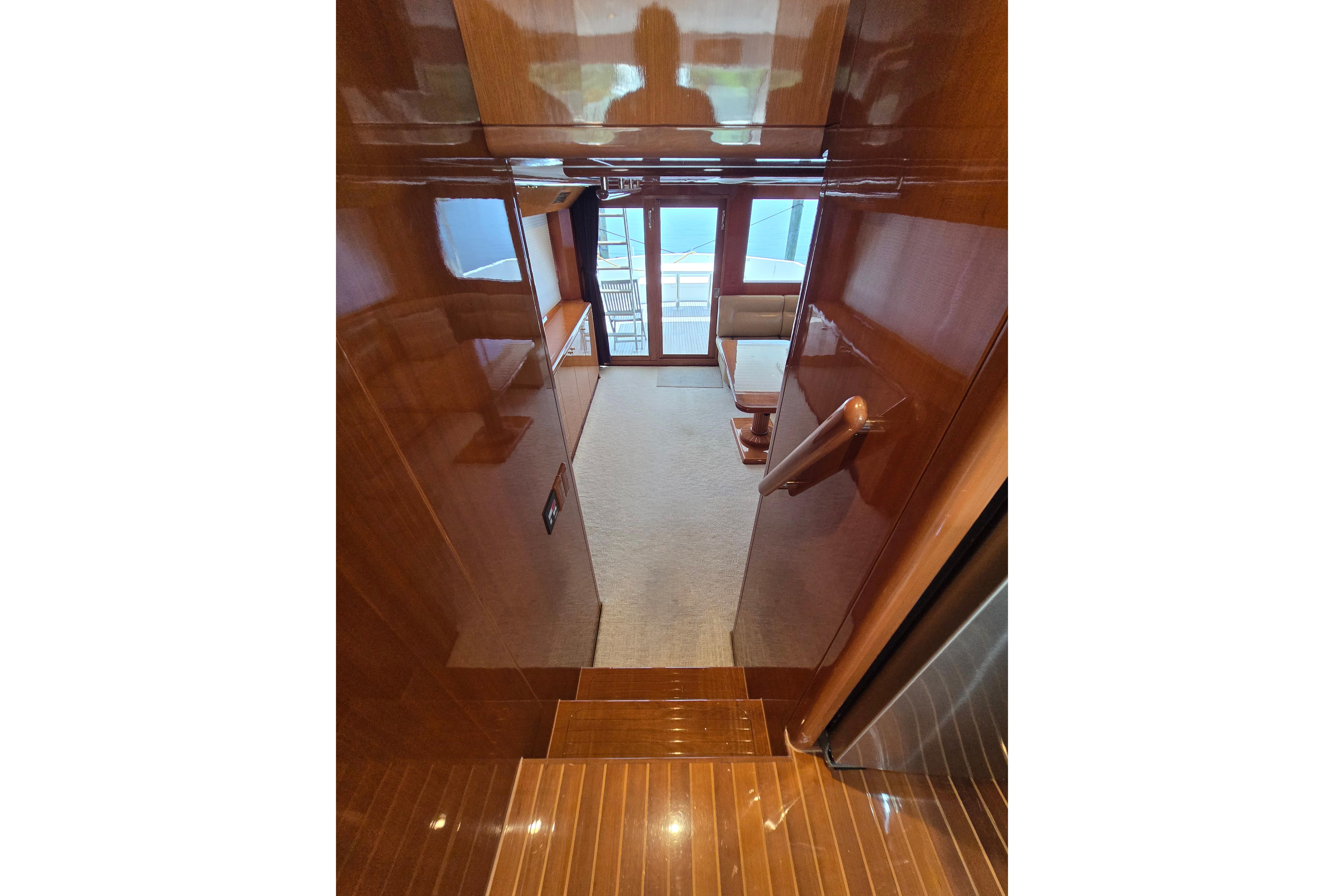 Luxurious interior of 2004 Grand Harbour 58 yacht with polished wood finish.