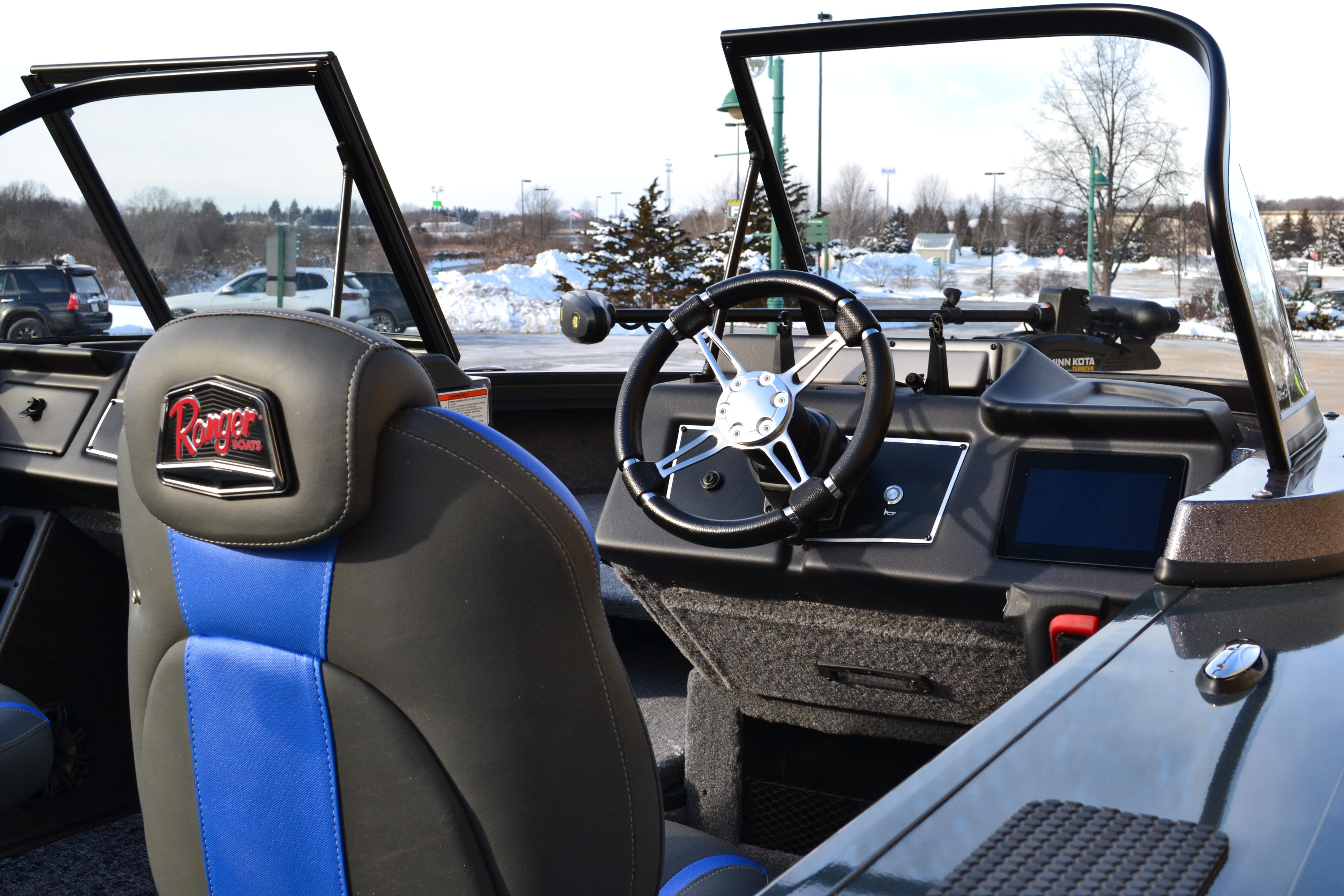 Interior of 2026 Ranger VX1888 WT boat with steering wheel and blue-accented seats.