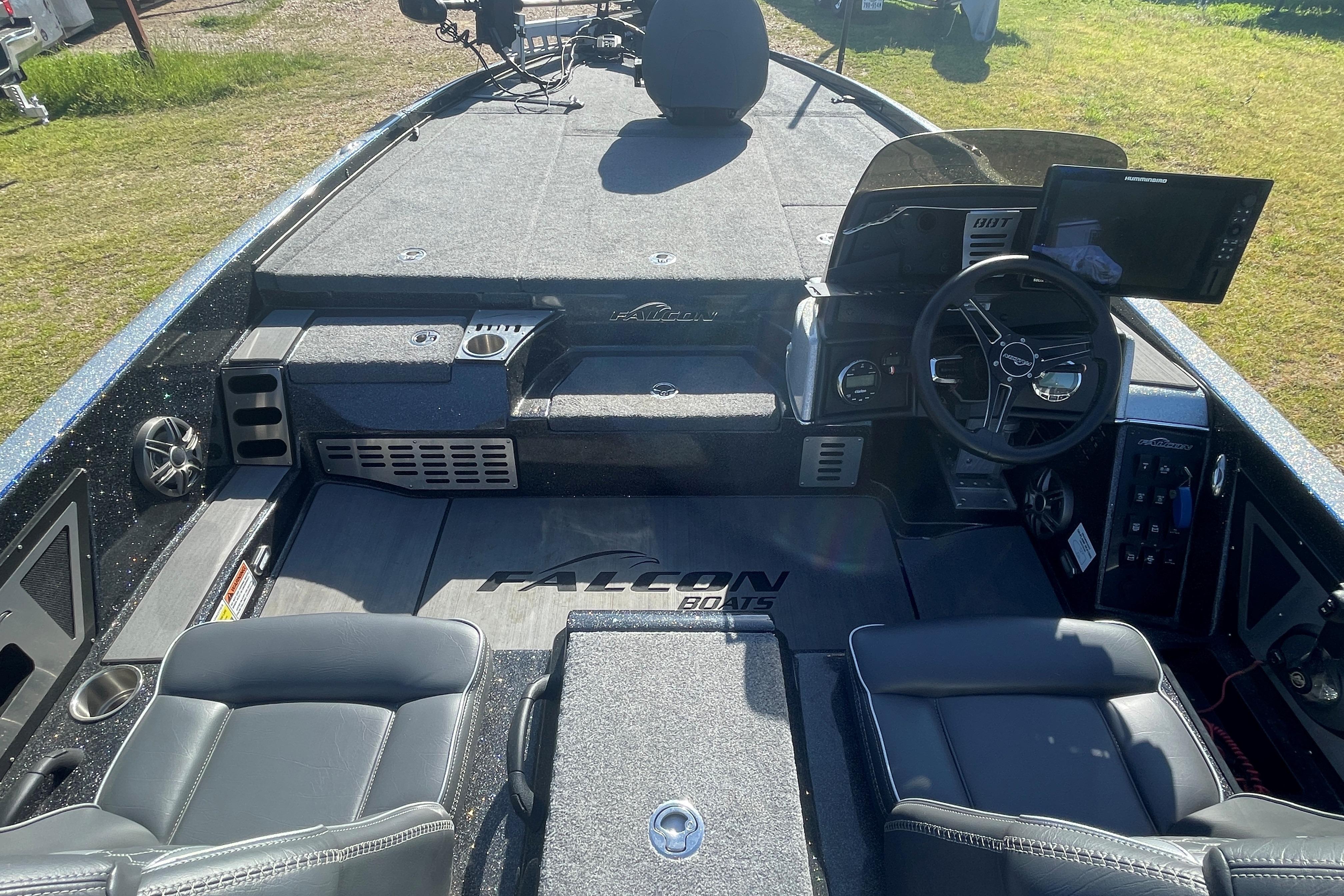 2021 Falcon Boats F20 PREDATOR interior with steering wheel and seating, showcasing modern design.