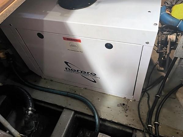 1987 Tollycraft Sundecker Diesel engine room with Norpro generator.