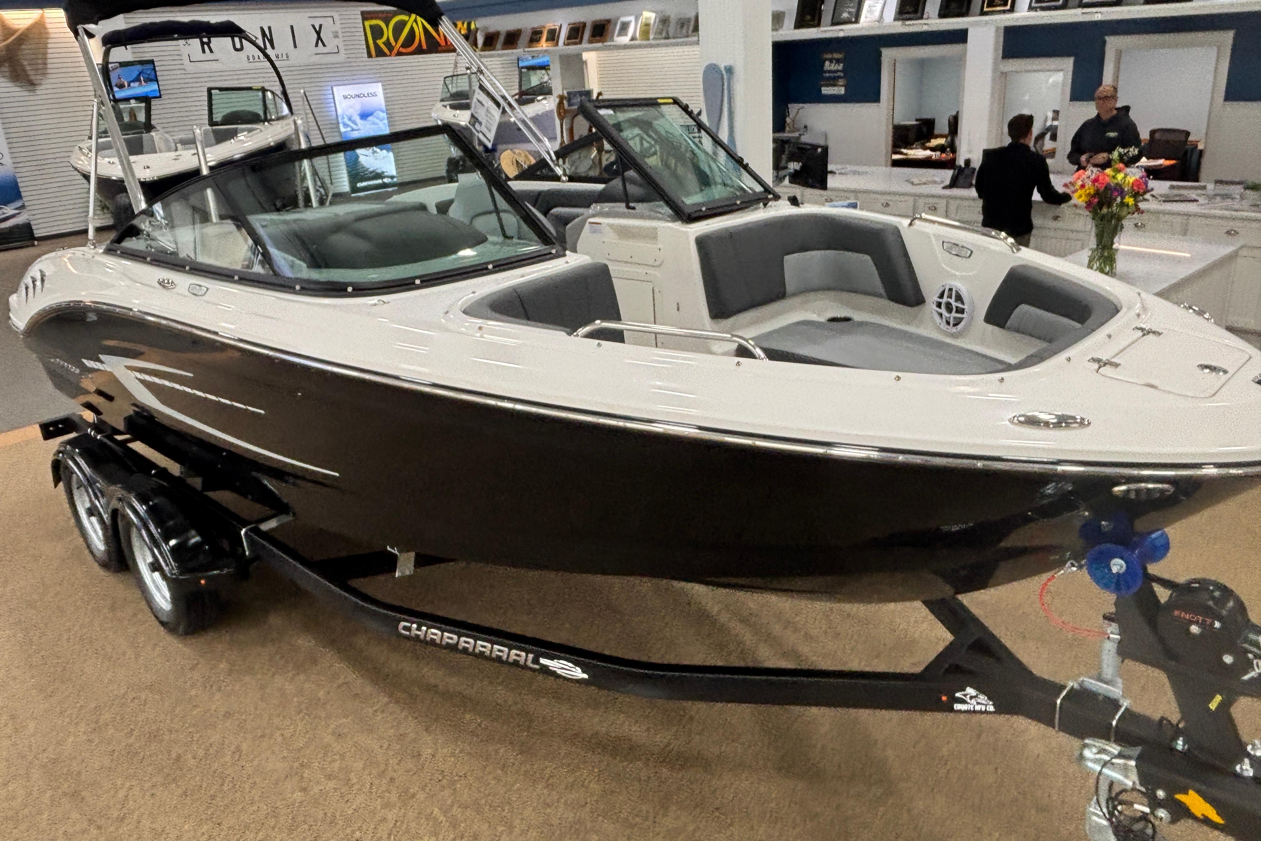 2026 Chaparral 21 SSi boat in showroom on trailer.