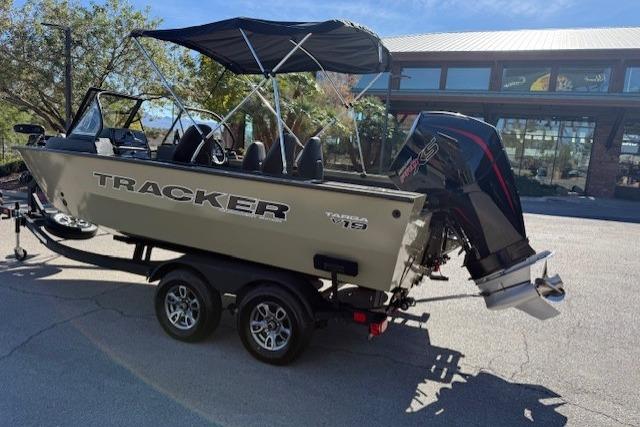 2026 Tracker Targa V-19 WT boat on trailer with canopy and outboard motor.
