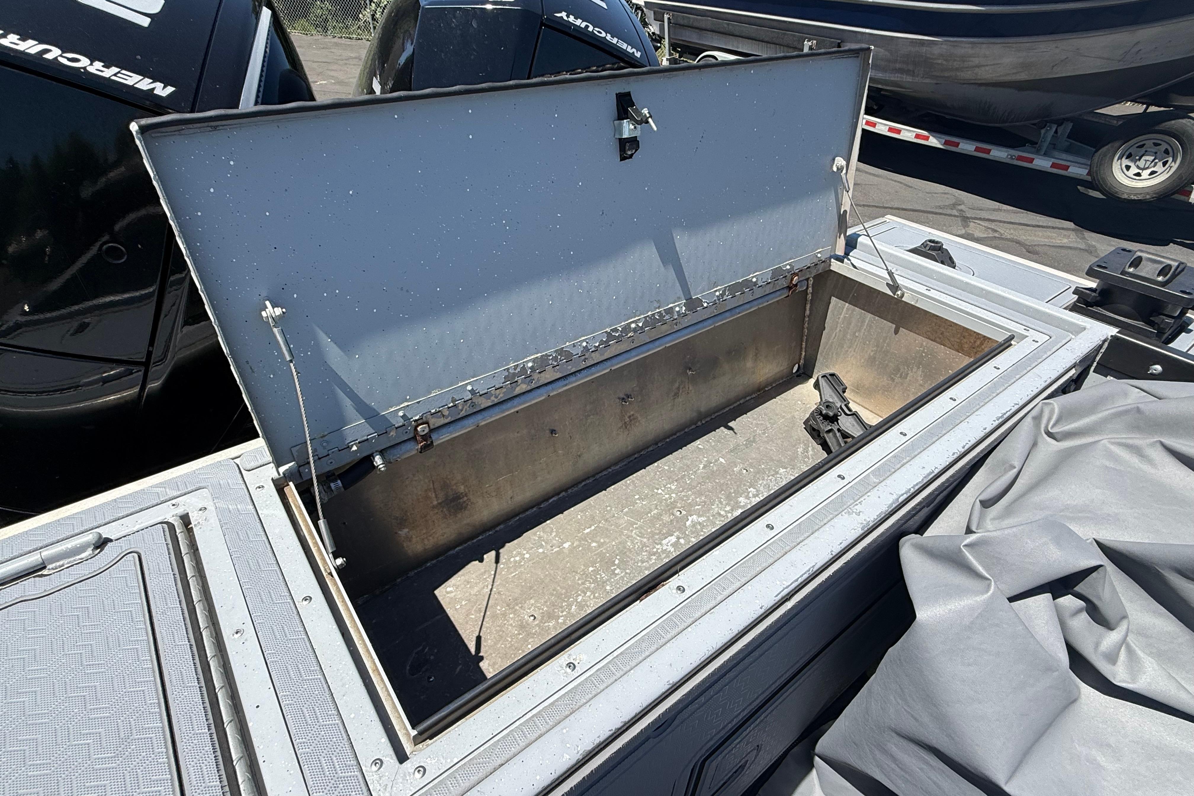 Open storage compartment on a 2015 Alumaweld Pacific XD 28 boat.