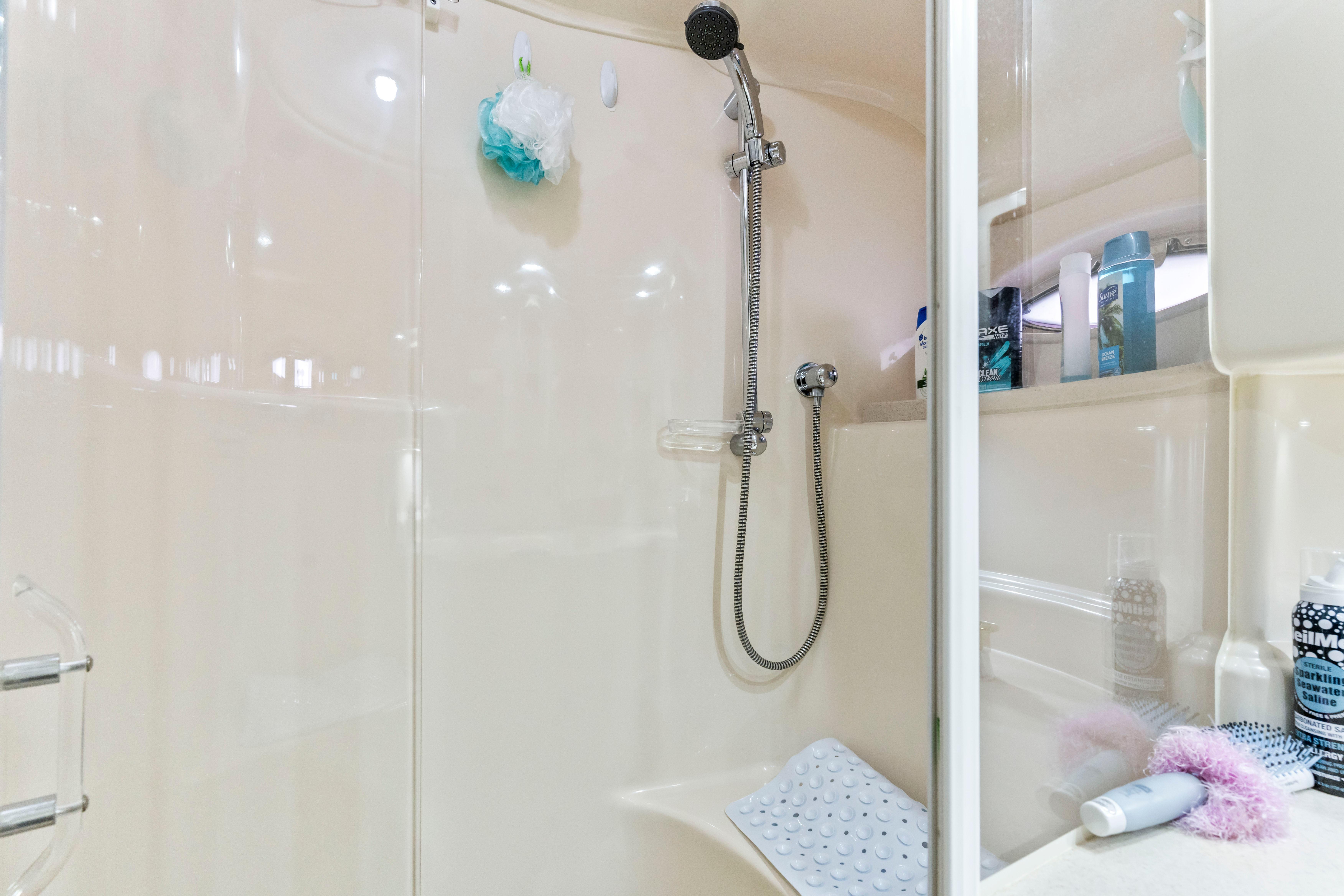 Shower area in 2001 Sea Ray Sundancer 510 yacht, featuring modern fixtures and toiletries.