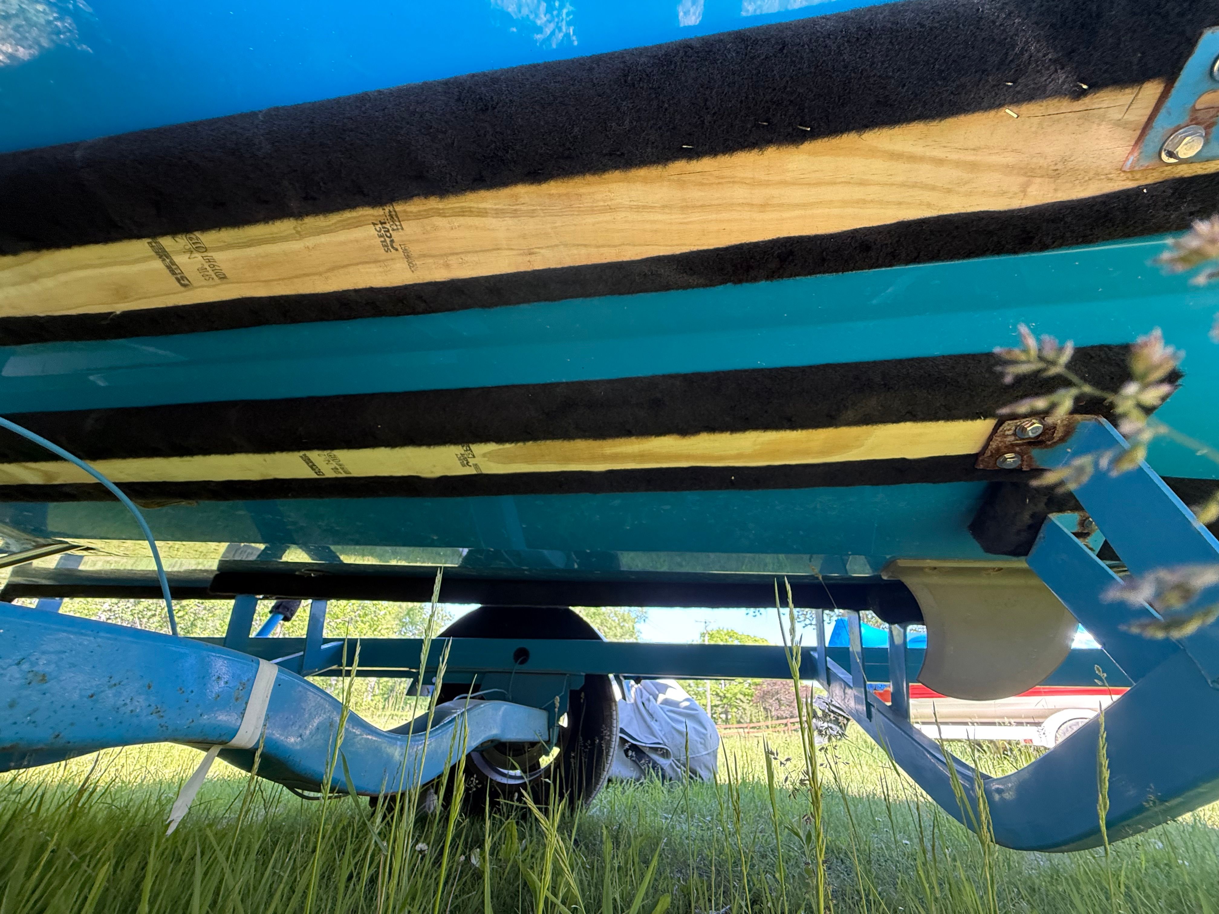 Underside of a 2015 Malibu Axis A20 boat on trailer.