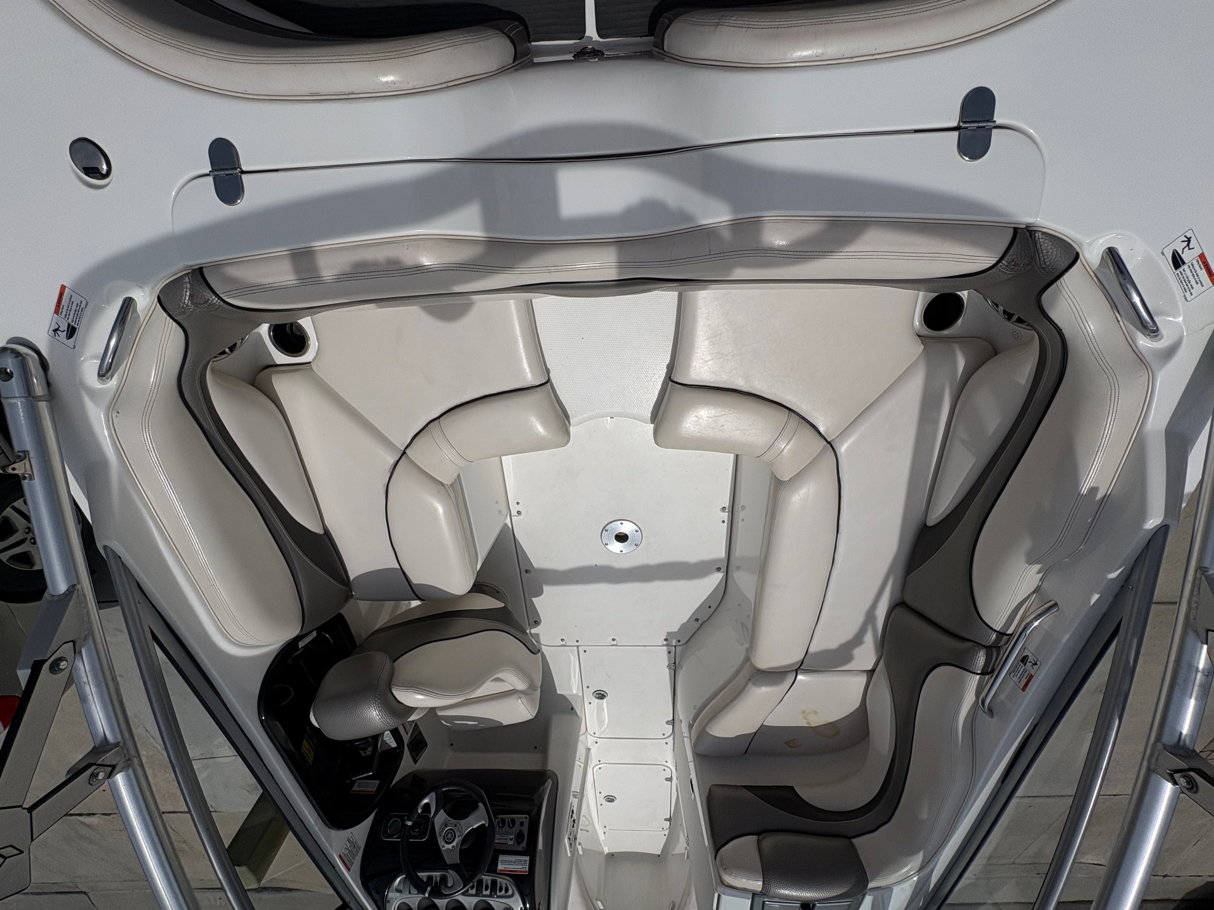 Interior of a 2009 Yamaha Boats 212X with white seating.