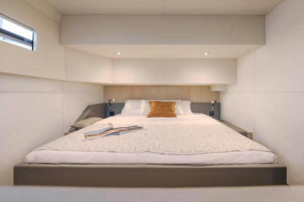 Luxurious bedroom interior of 2025 Privilege Signature 650 yacht with modern design.