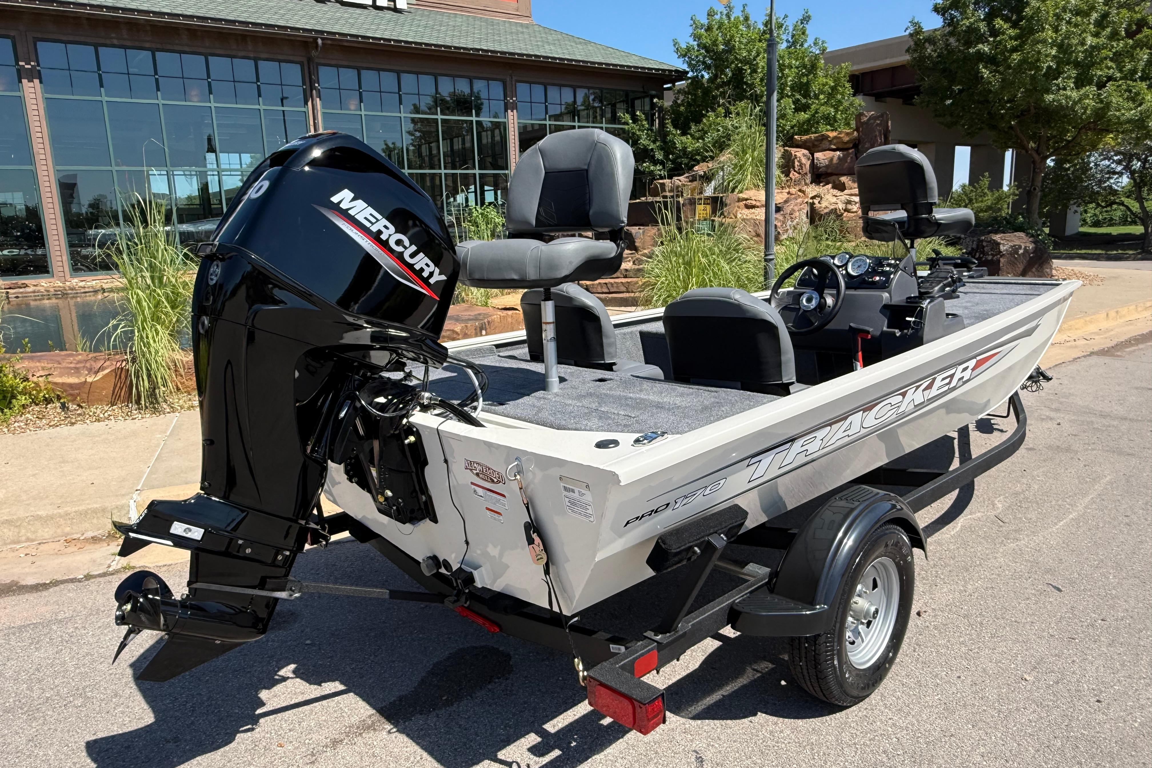2026 Tracker Pro 170 boat with Mercury engine, parked outdoors.
