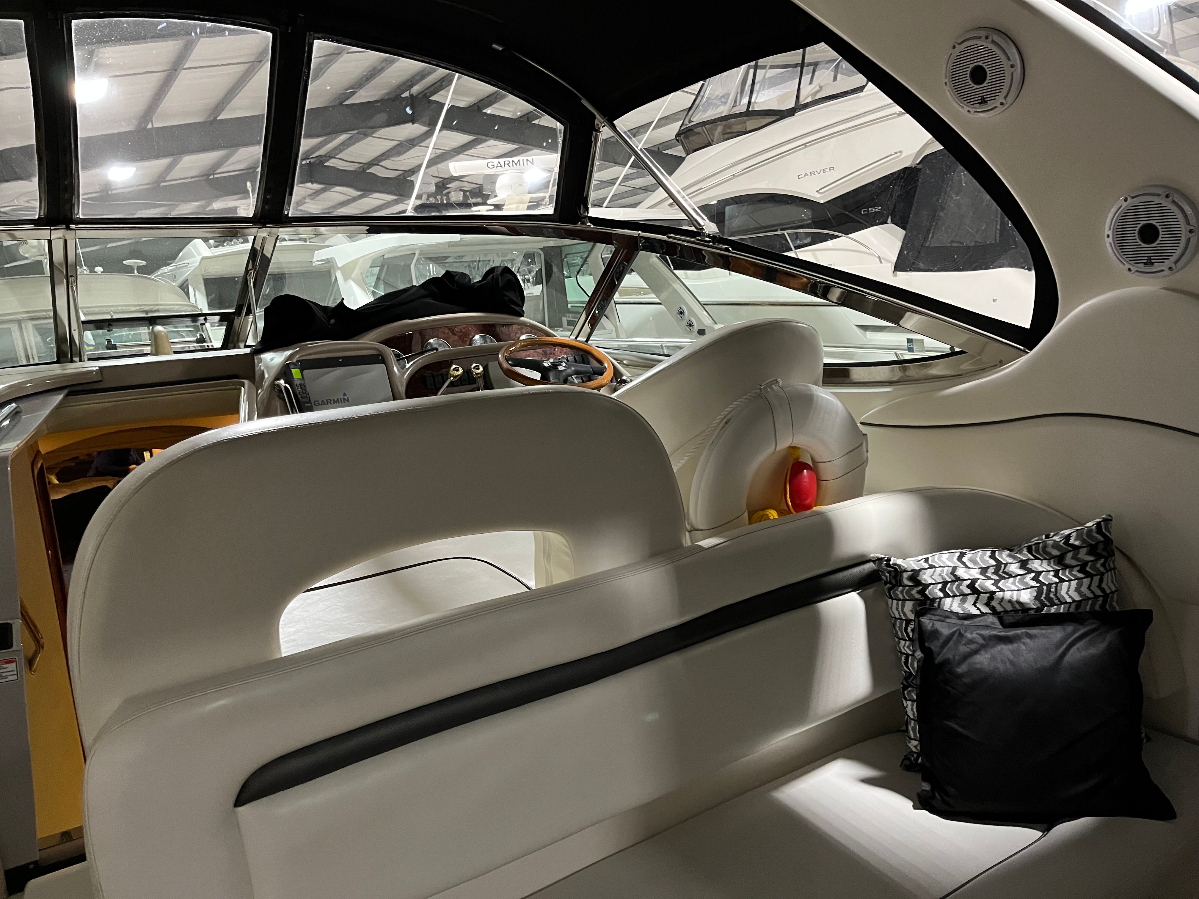 Interior of a 2005 Sea Ray Sundancer yacht with elegant seating.