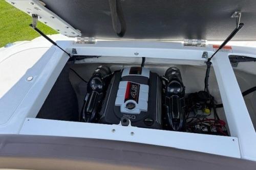 2017 Rinker QX21 BR boat engine compartment with open hatch.