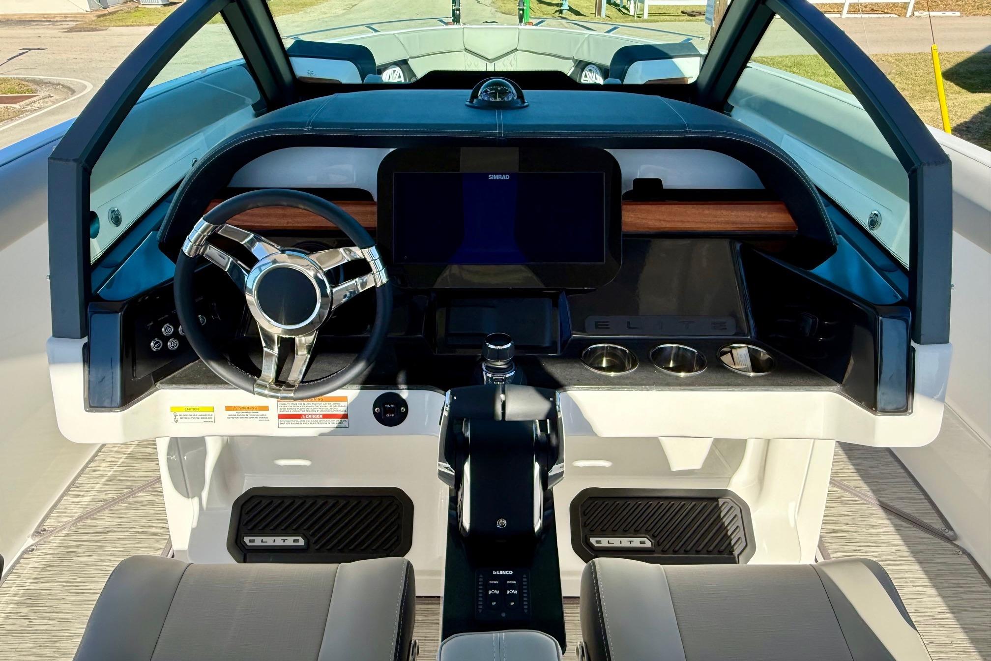 Interior view of the 2026 Monterey Elite 30 OB boat cockpit.