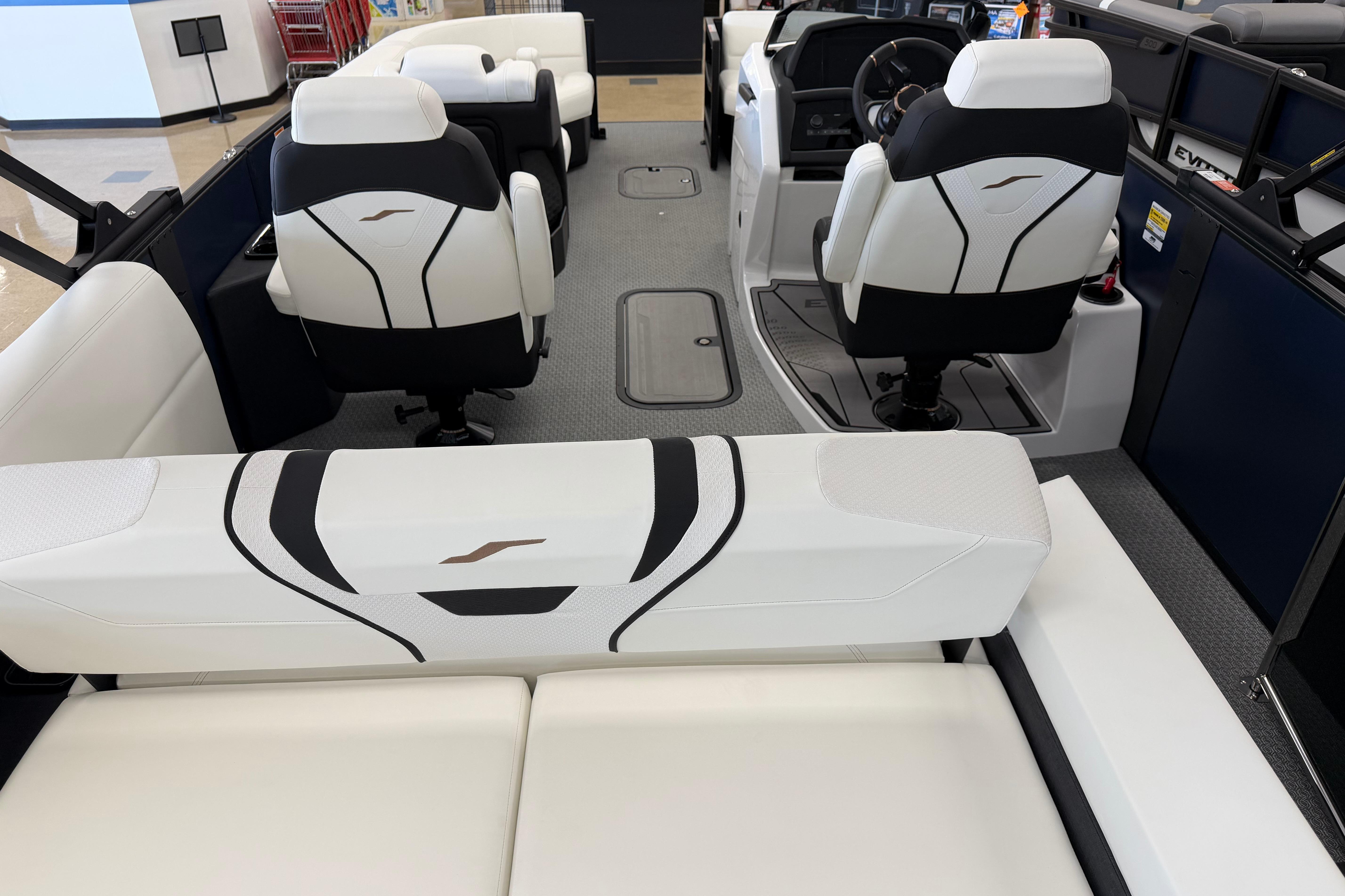 Interior of 2026 Evotti 721CS boat with modern seating and steering console.