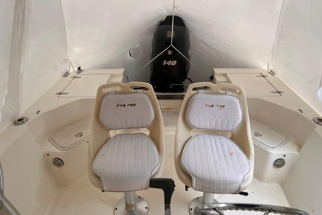 2001 Sea Pro 190 Center Console boat interior with dual seats and Suzuki 140 outboard motor.