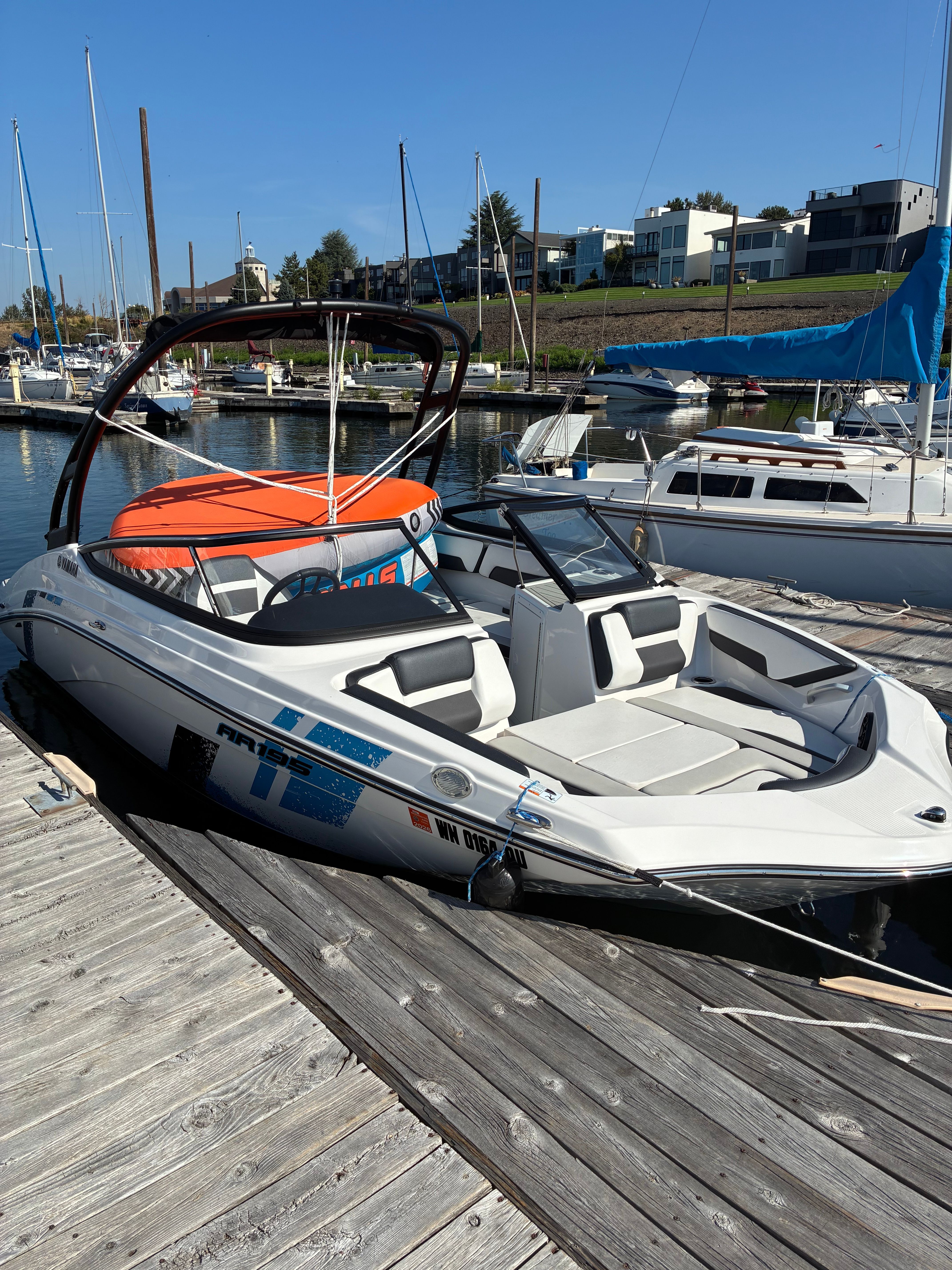A 2022 Yamaha AR195 boat docked on a sunny day.
