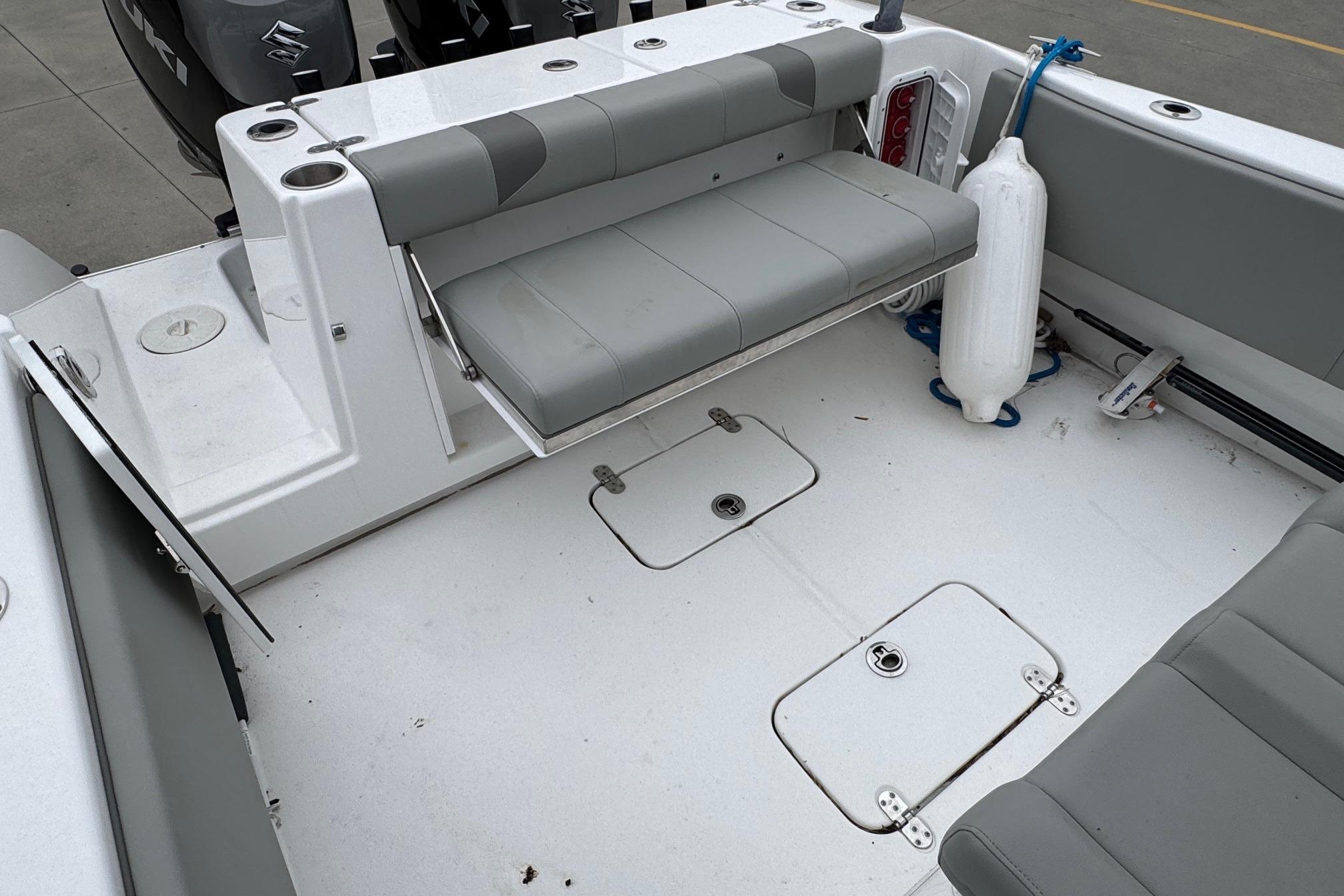 2024 Cape Horn 32 XS boat interior with foldable seating and storage compartments.