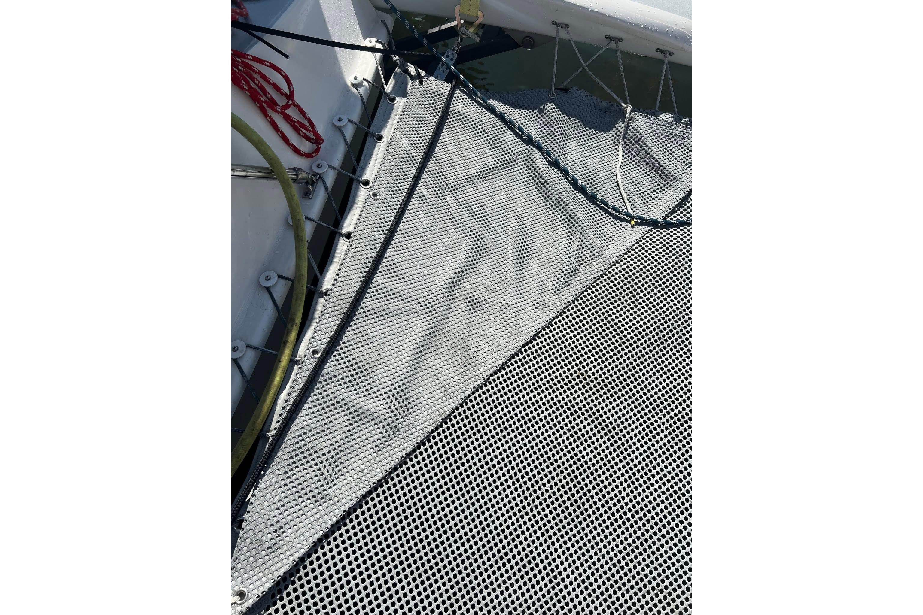 Close-up of 1993 Corsair F-27 sailboat netting and rigging details.