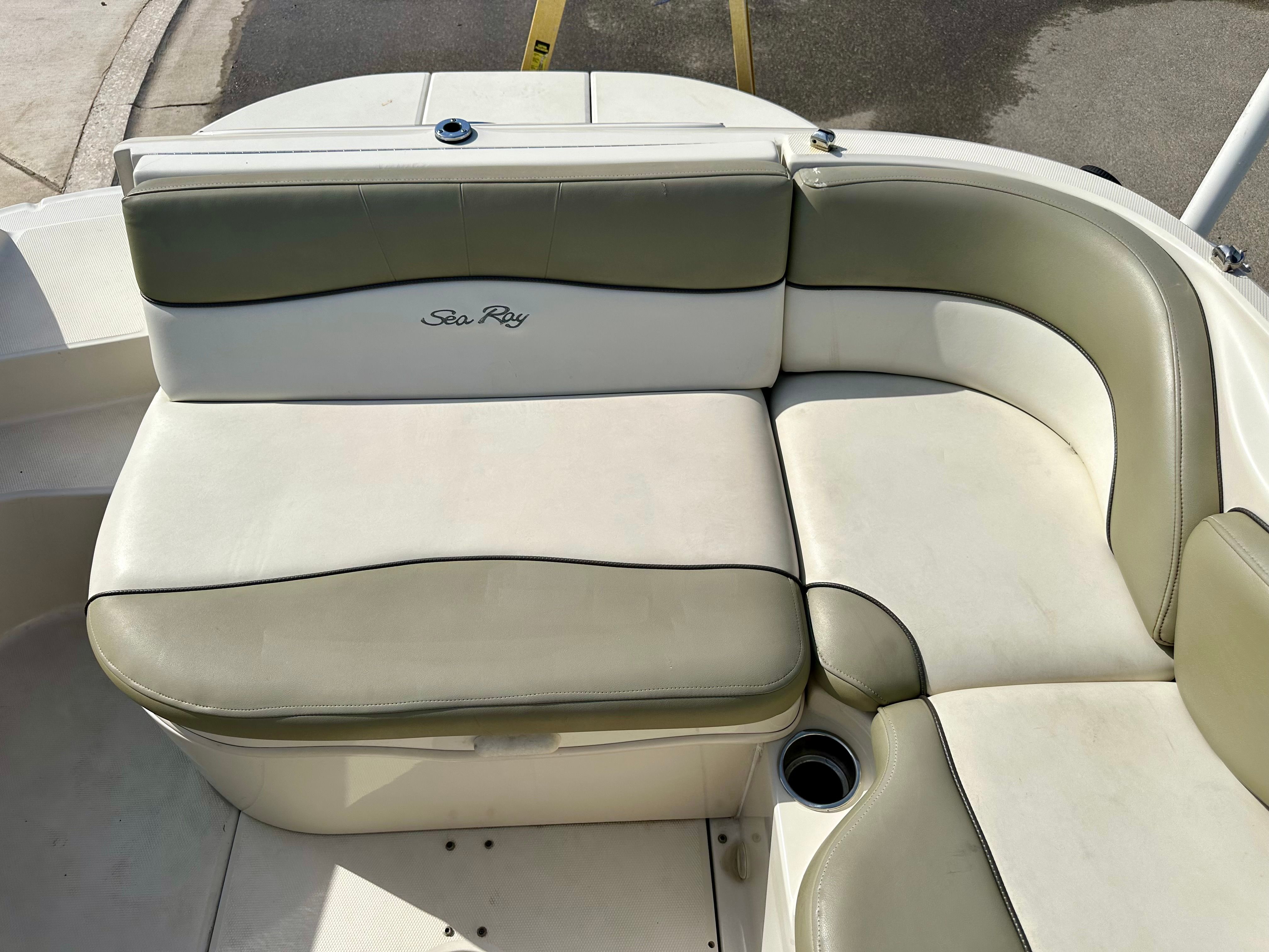 2006 Sea Ray 240 Sundeck seating area with beige upholstery.